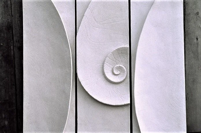Shellwave Between Two Concave Moons wall sculpture seen closer, showing the spiral and concave crescent panels