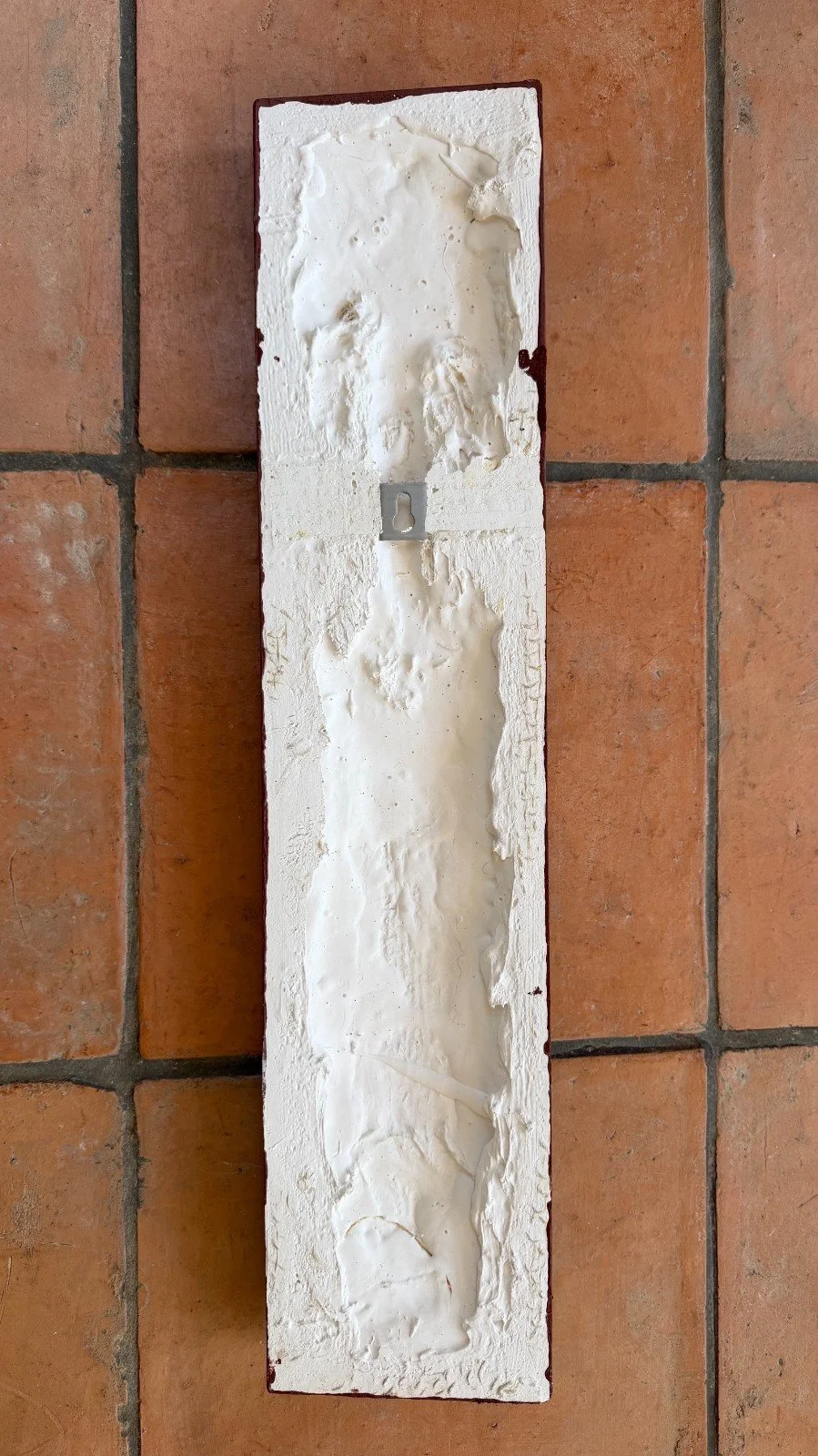 Reverse of the Frozen Deco wall sculpture, showing the white gypsum composite back and metal hanging fixing