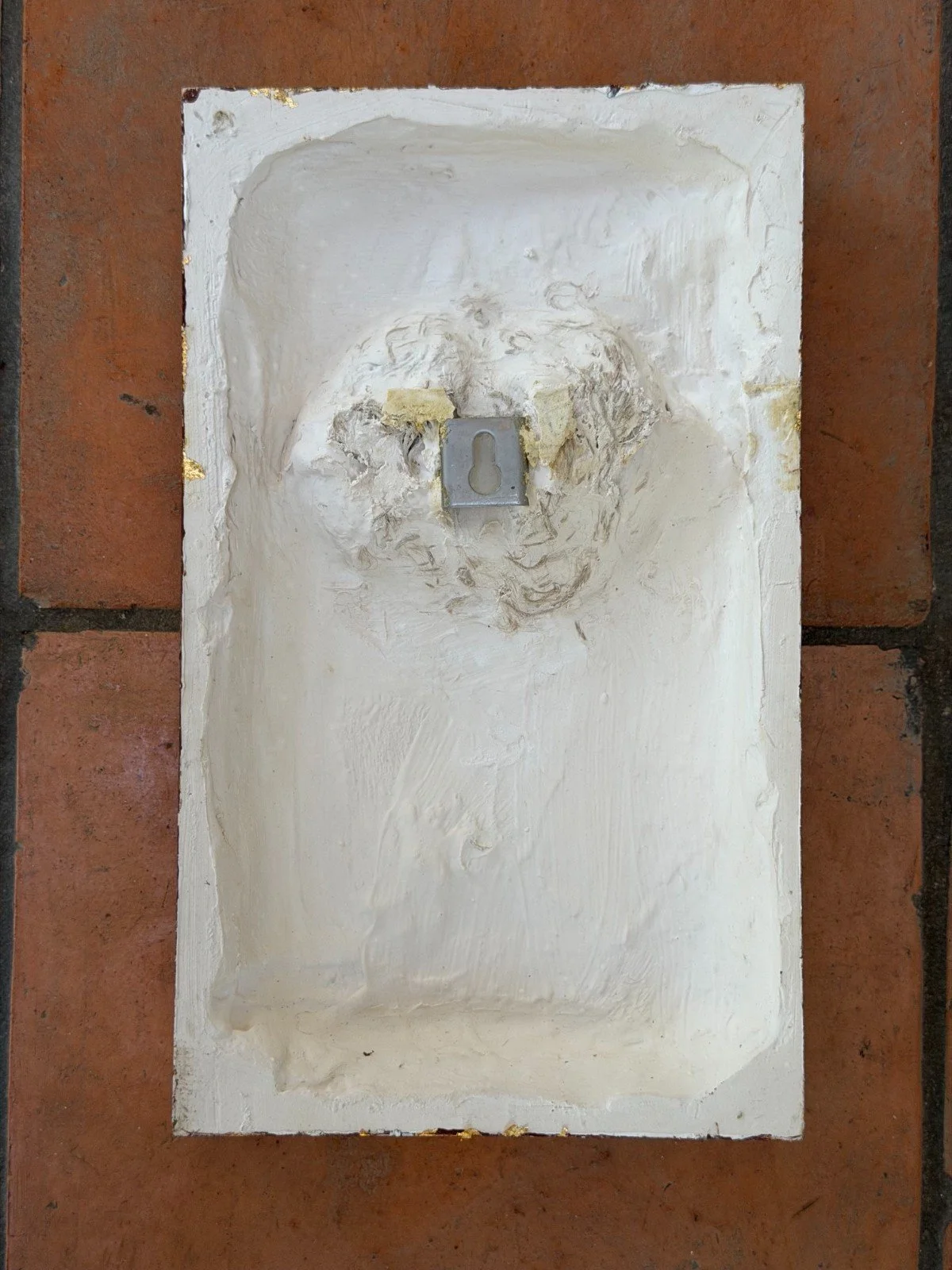 Reverse of the copper wave relief wall sculpture, showing the recessed white gypsum back and metal hanging fixing