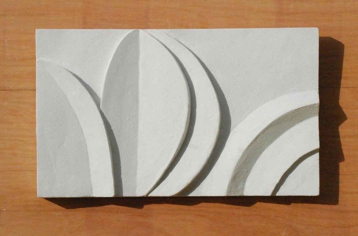 White Acanthus and Moon relief with a central leaf and curved bands, displayed on timber.