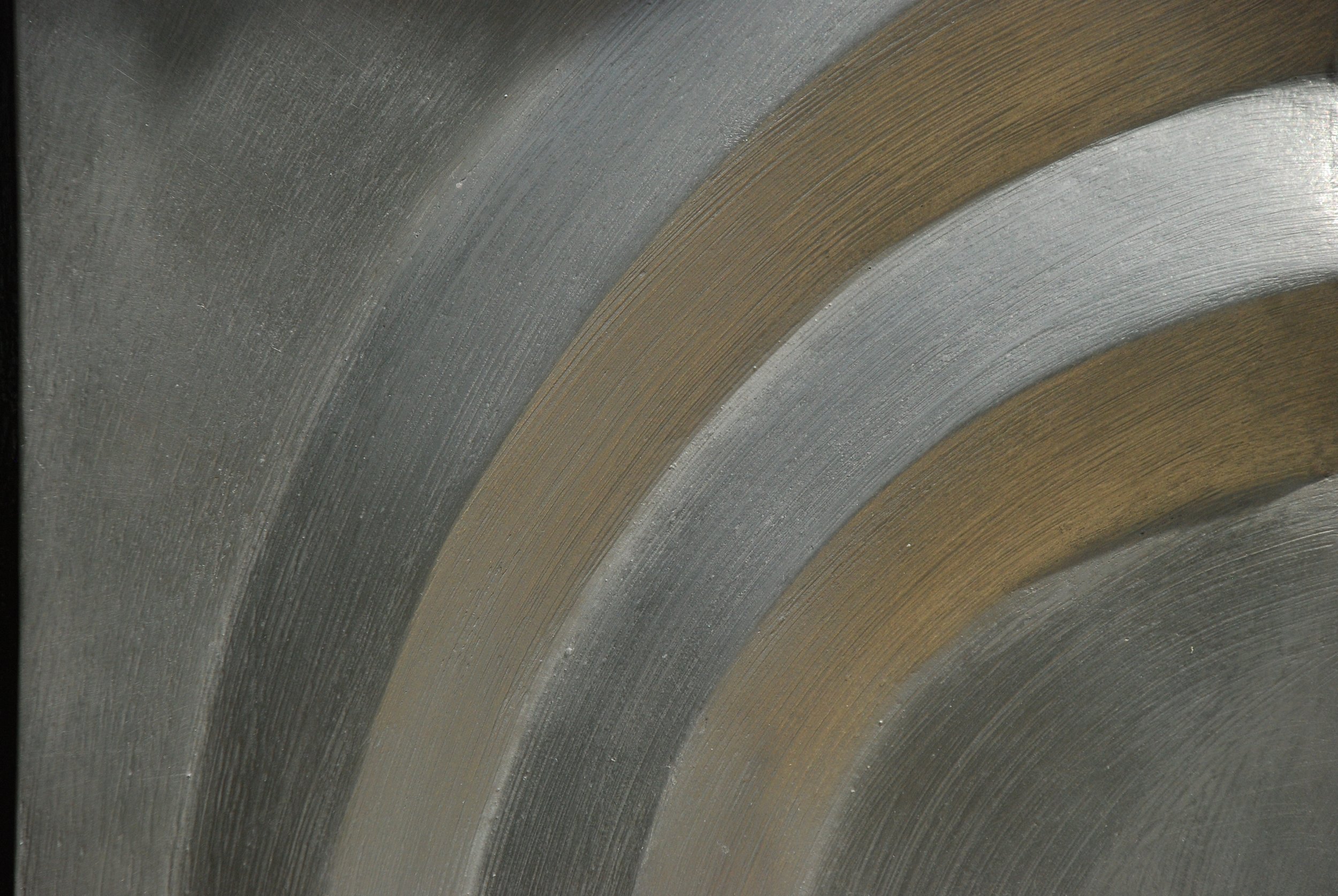 Close-up of the pewter-coloured Acanthus Two Leaves relief, showing brushed curved bands.