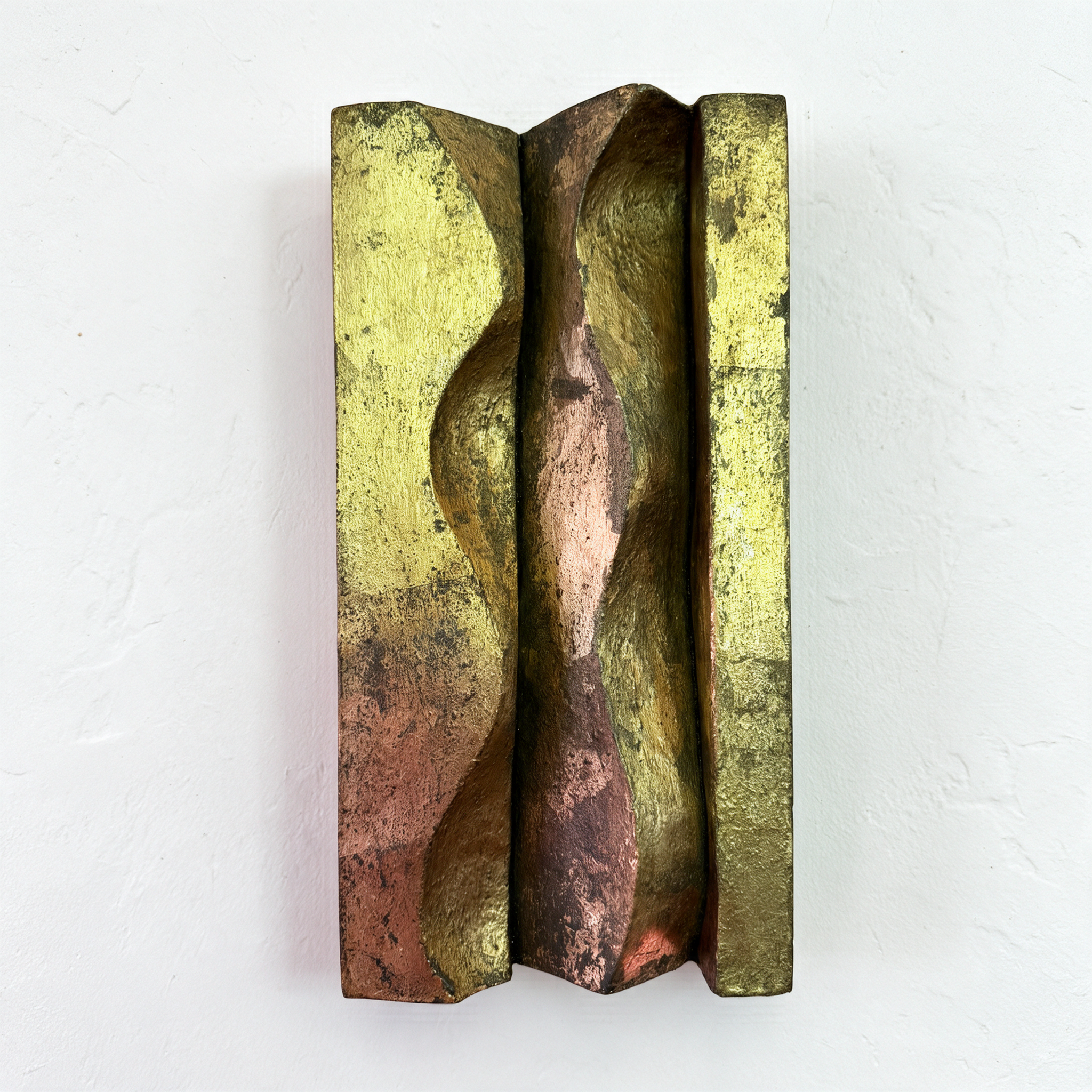 Brancusi 1 relief with a dark central wave and mottled gold-coloured surface against white.