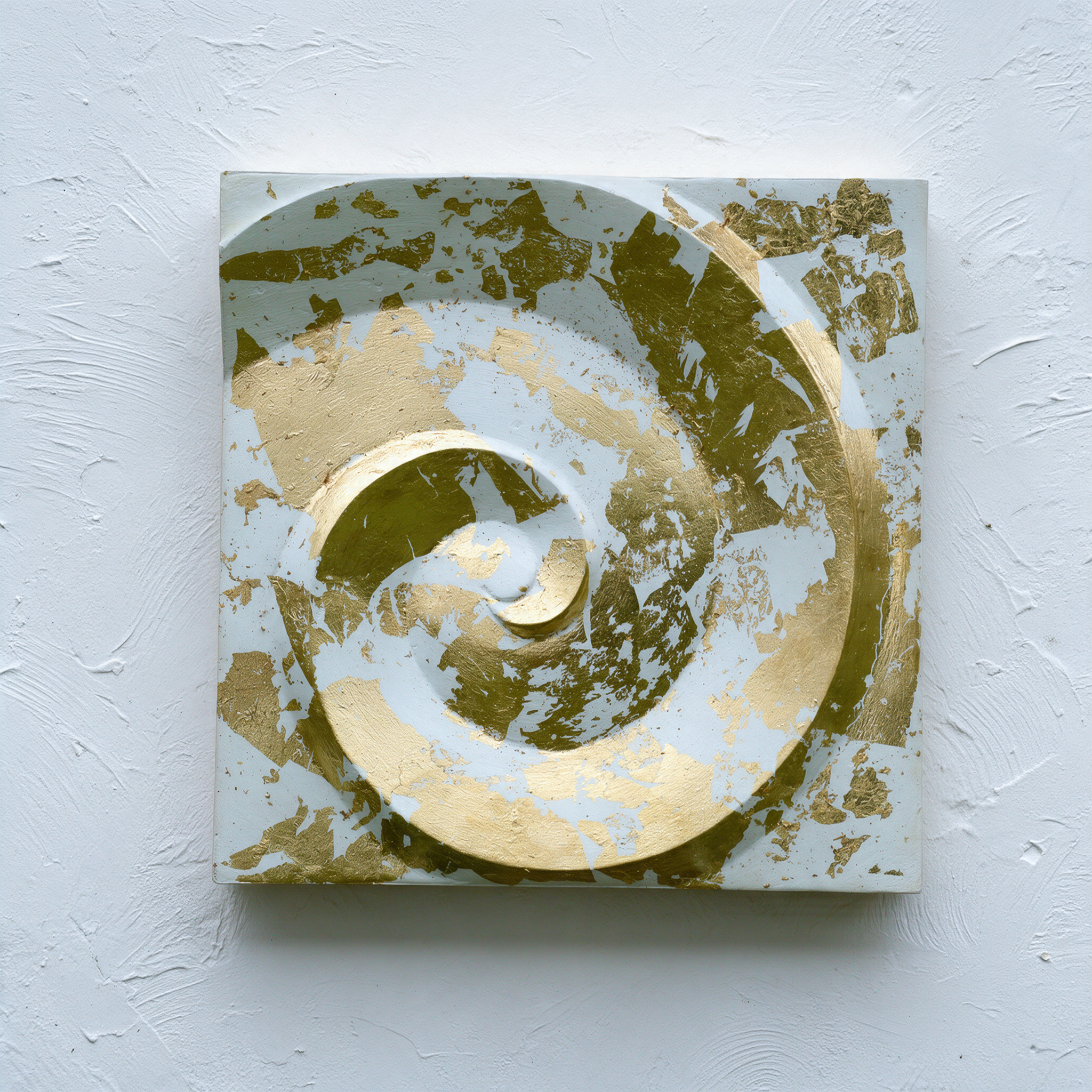 Deco Palm and Spiral relief with a raised spiral and mottled white and gold-coloured surface.