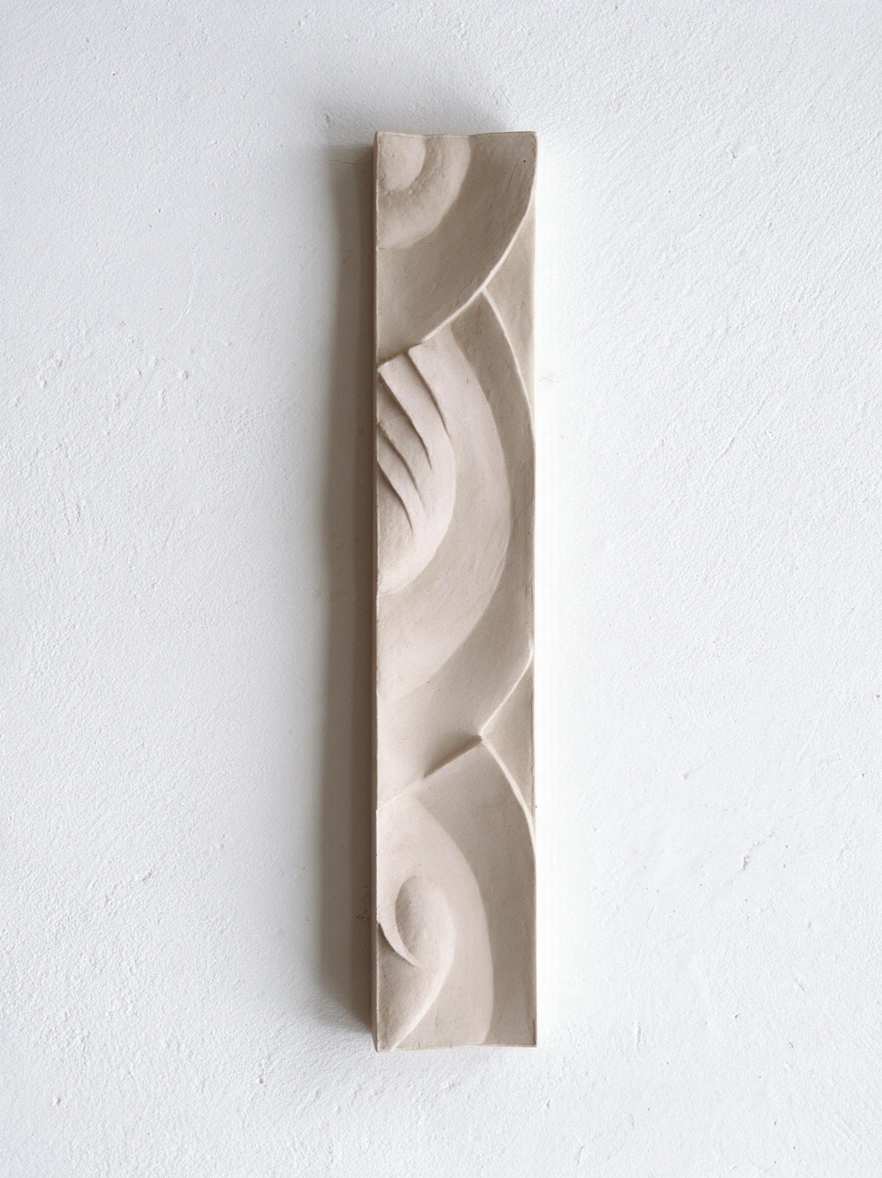 White Frozen Decowaves 2 relief with sweeping curves, a fan motif and small spirals.
