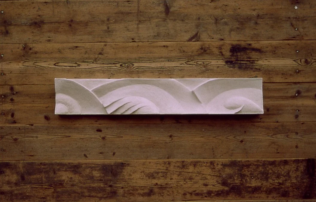 White Frozen Decowaves 2 relief displayed horizontally on timber.
