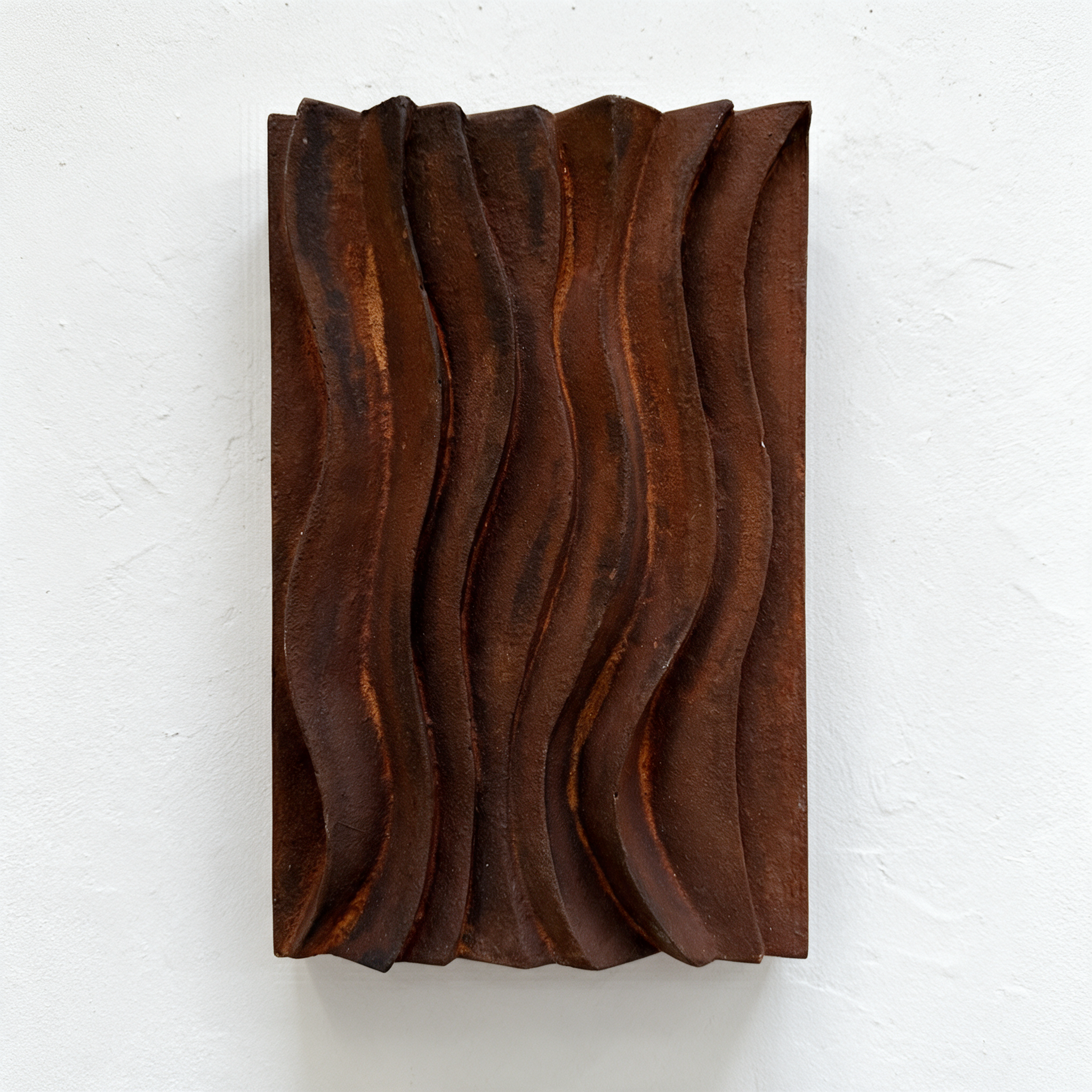 Rust-coloured Dune Ripple 1 relief with flowing vertical ridges against a white background.