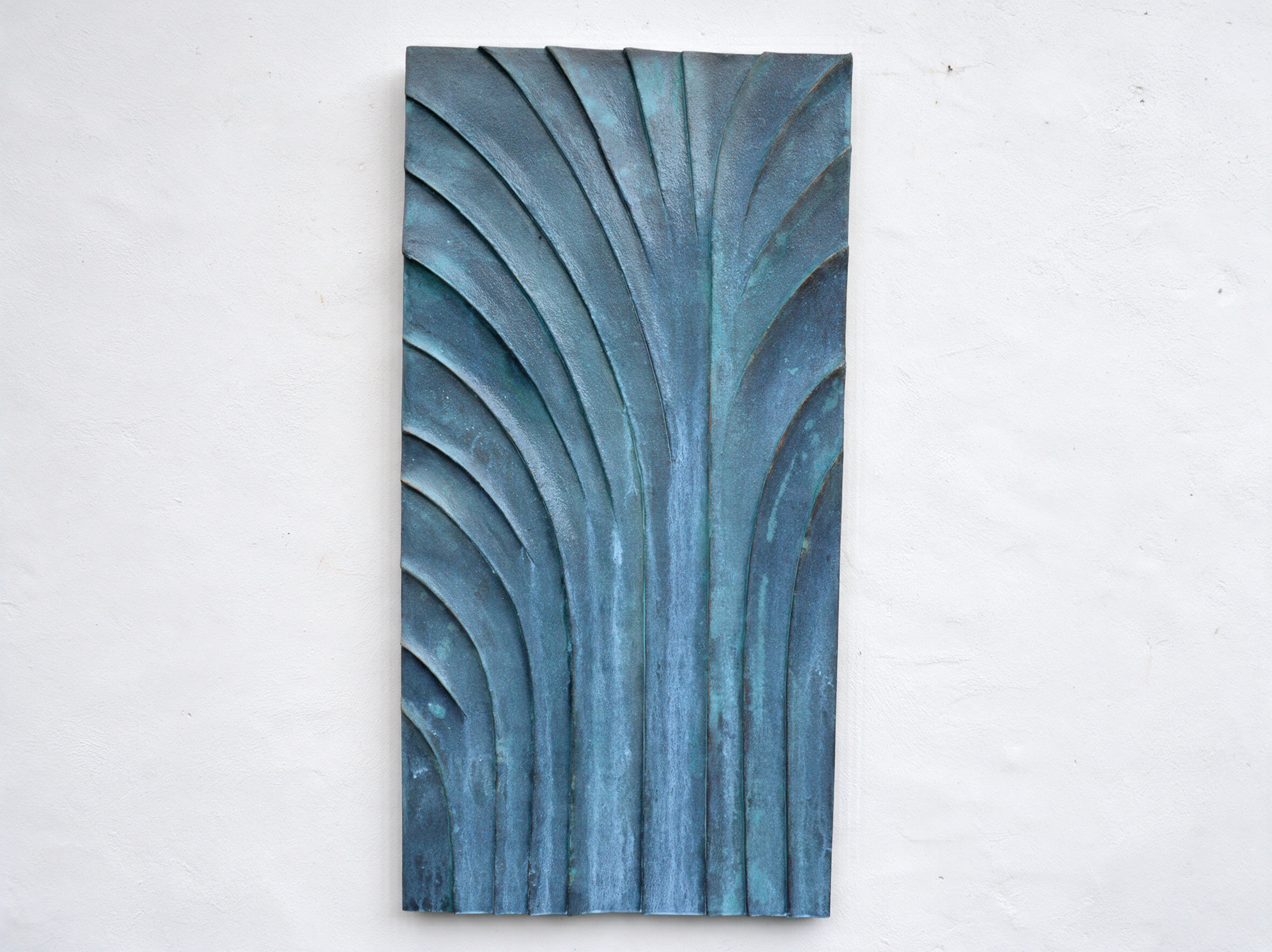 Bronze and verdigris Fountain Palm Egyptian with long curved ribs spreading from the base.