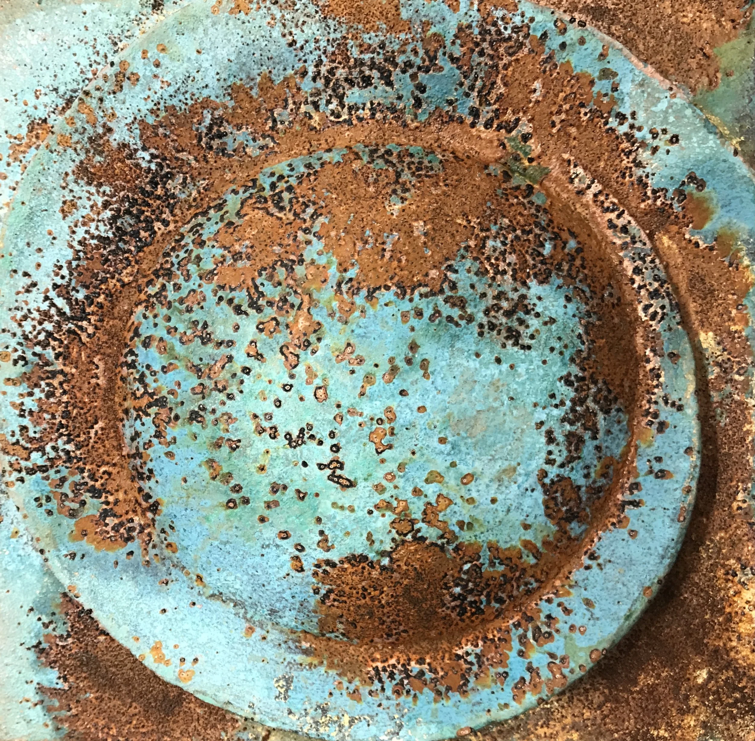 Close-up of verdigris and rust Moon Crater Phase 2, showing the circular ridge and mottled texture.