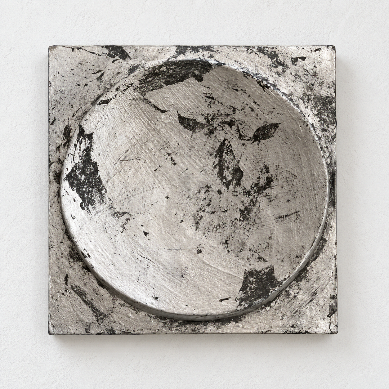 Silver and dark bronze-coloured Moon Crater Phase 4 relief with a shallow circular bowl.