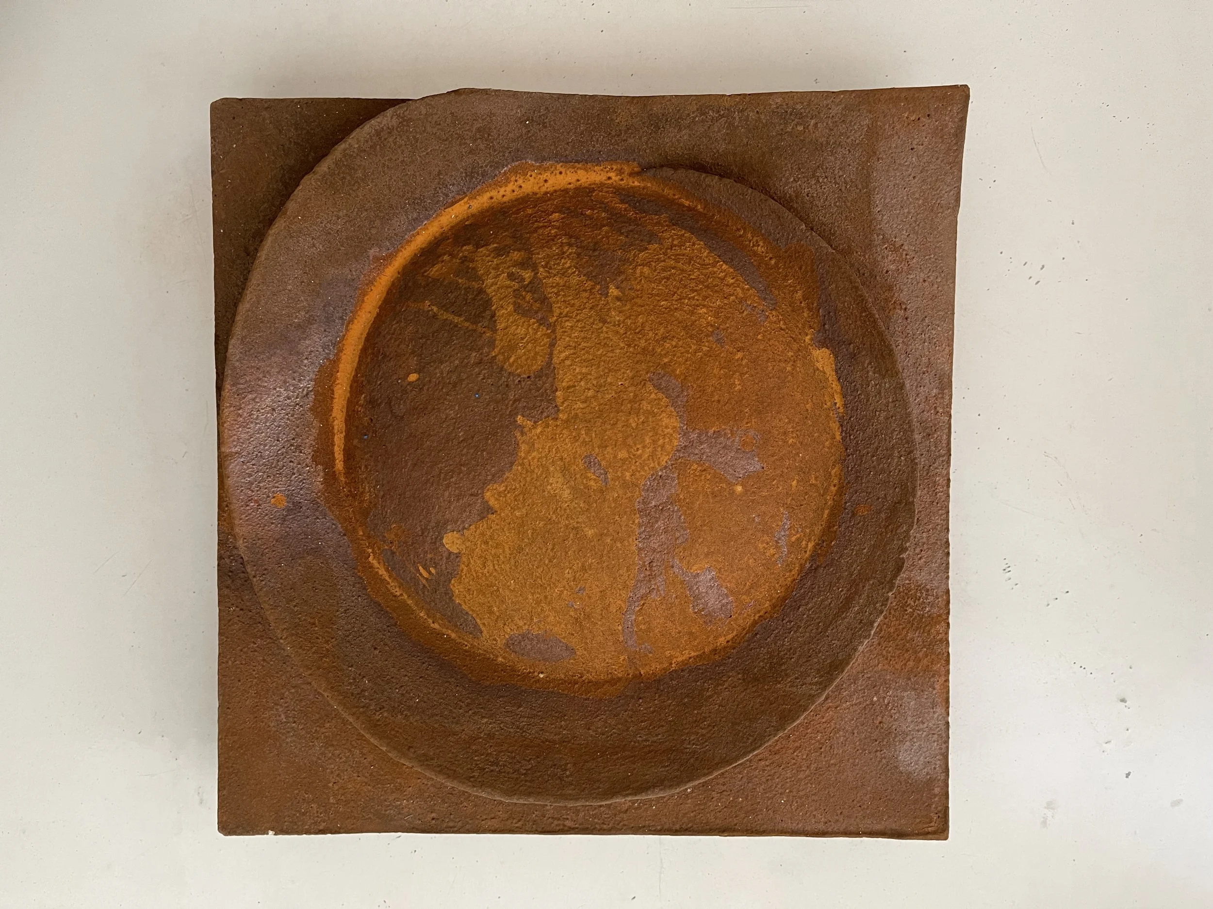 Front view of rust-coloured Moon Crater Wide Lip Drip, with a broad dark circular rim.