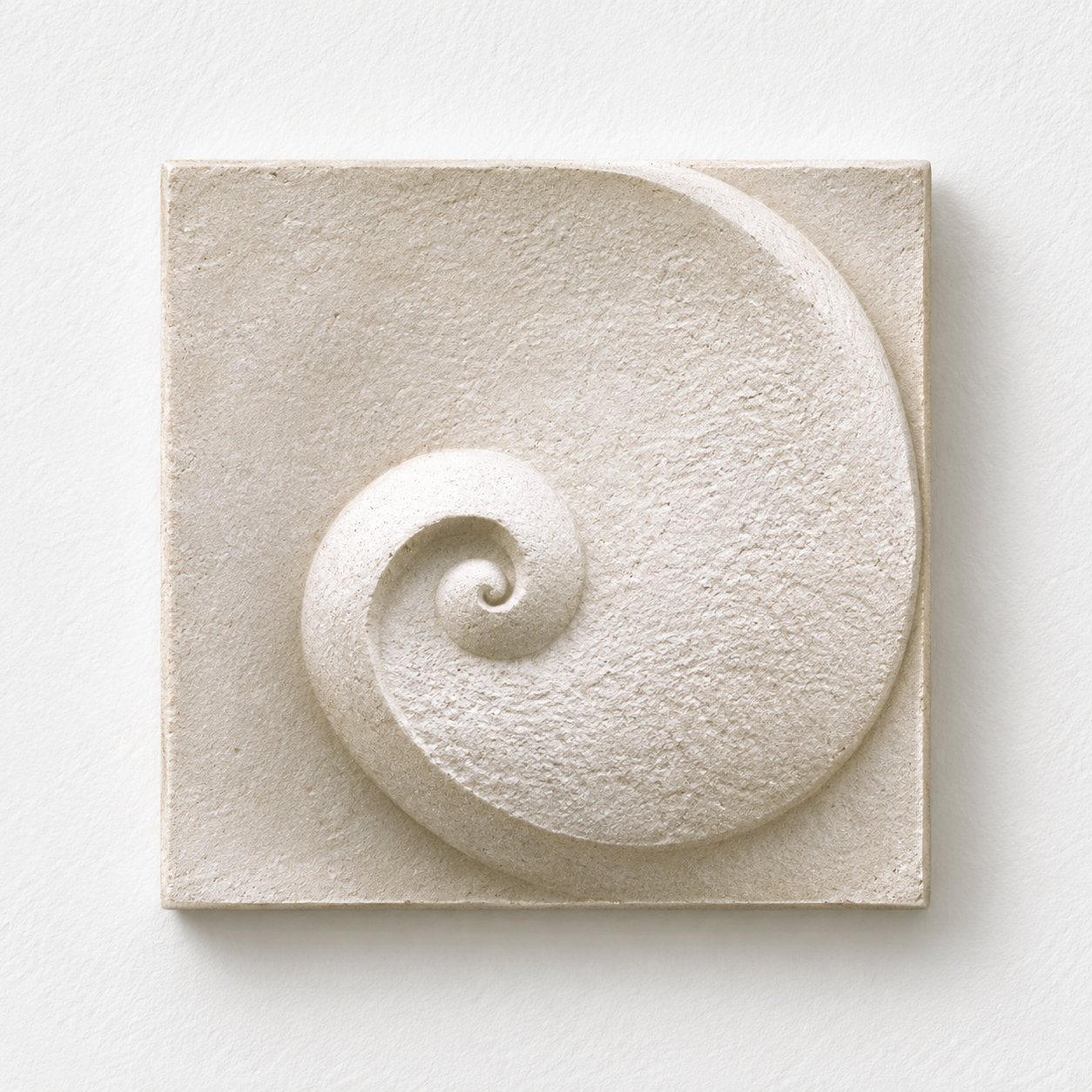 White Moonphase 1 relief with a textured spiral and broad outer curve against white.