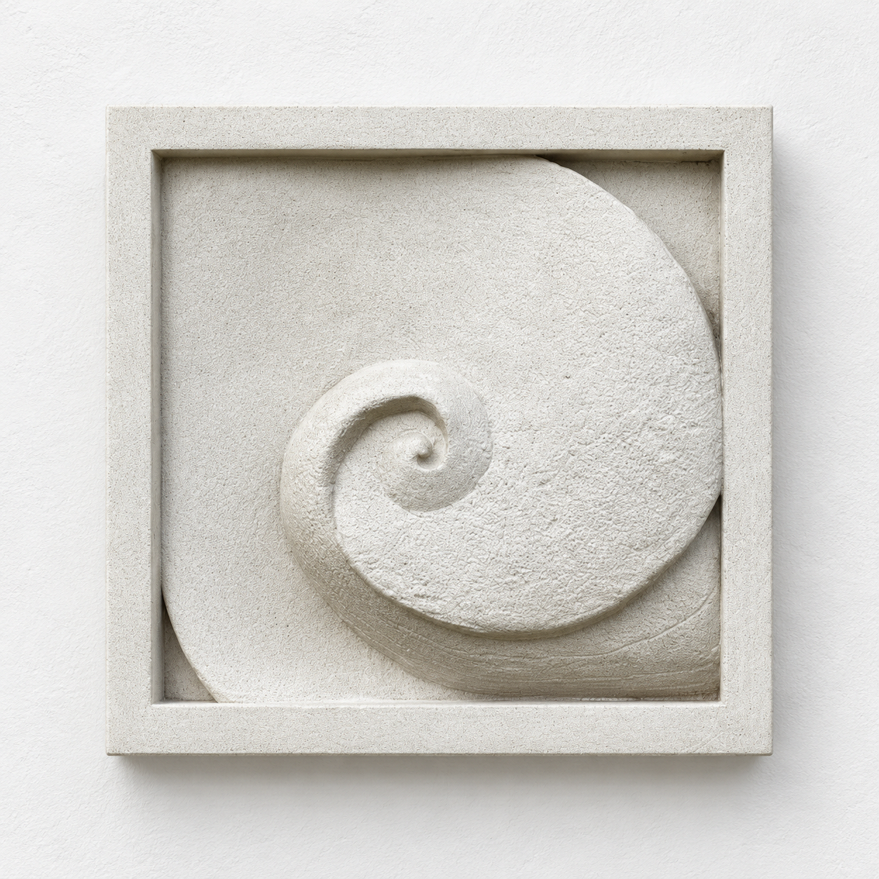 White Moonphase 1 relief with a square border framing the central spiral, against a white background.