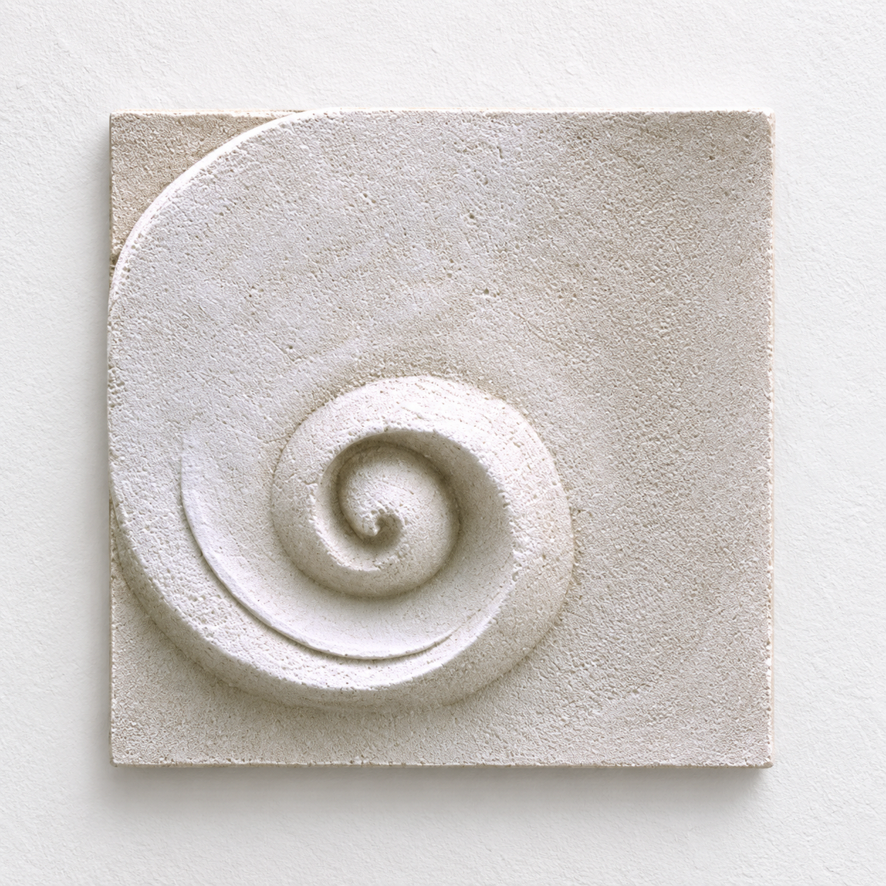 Front view of the white Moonphase 3 spiral relief against a pale background.