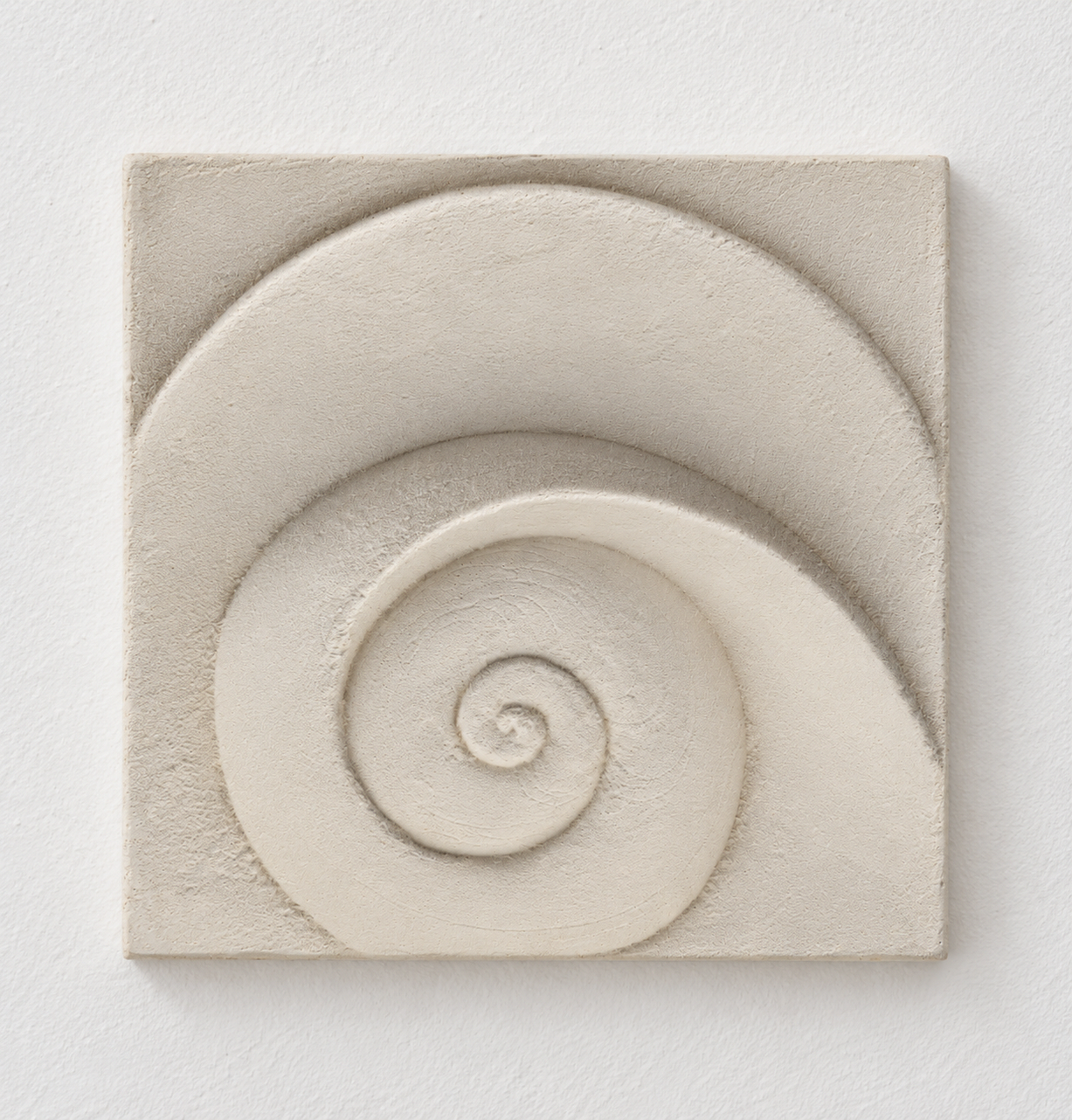Close view of the softly textured white Moonphase 2 spiral and sweeping curved band.