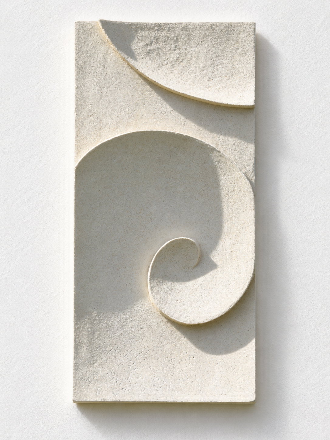 White Moonwave relief arranged vertically against a white background.