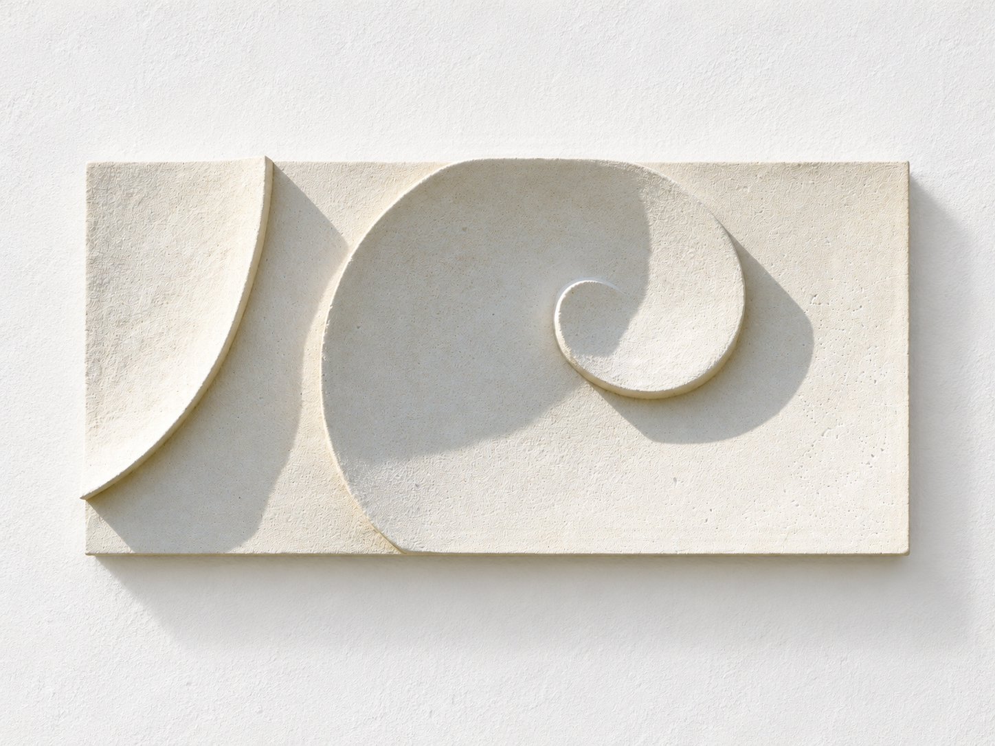 White Moonwave relief arranged horizontally, showing two opposing crescents and a small curl.