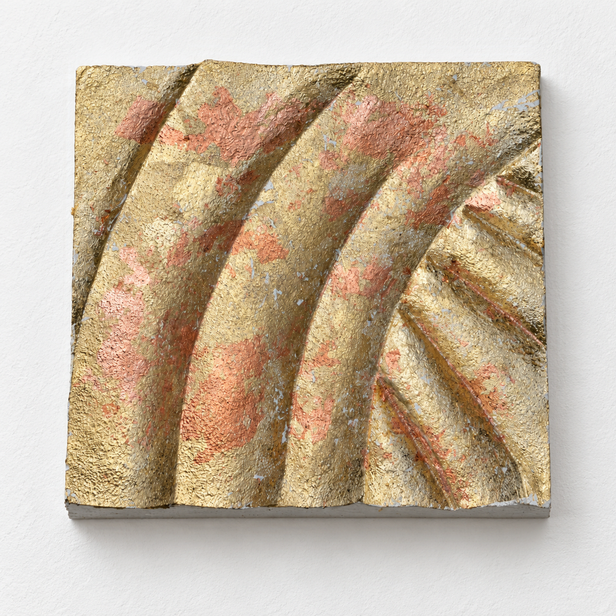 Panel Curves relief with sweeping bands and a mottled gold-coloured textured finish.