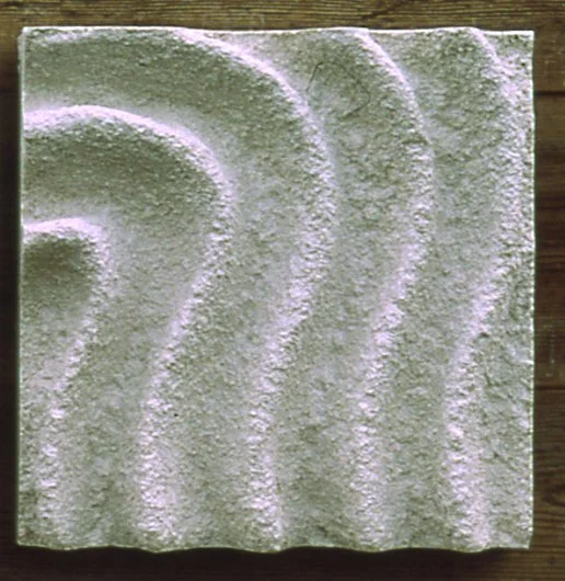 Raked Spiral 2 wave relief arranged vertically, photographed in outdoor light.