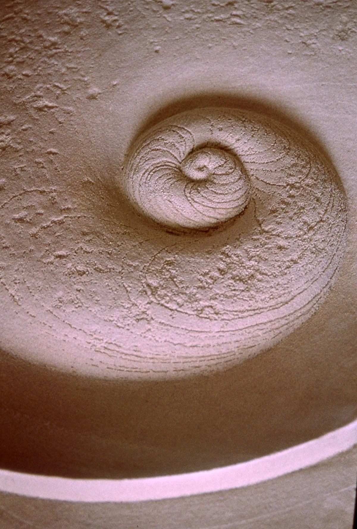 Close-up of the Battersea Shellmoon 1 relief, showing its textured spiral centre.