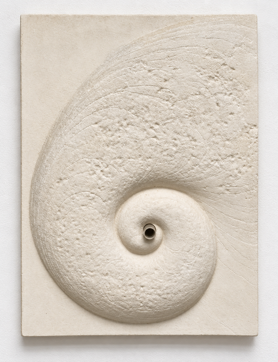 White Battersea Shellmoon 2 Water Feature relief, with an outlet at the centre of the spiral.