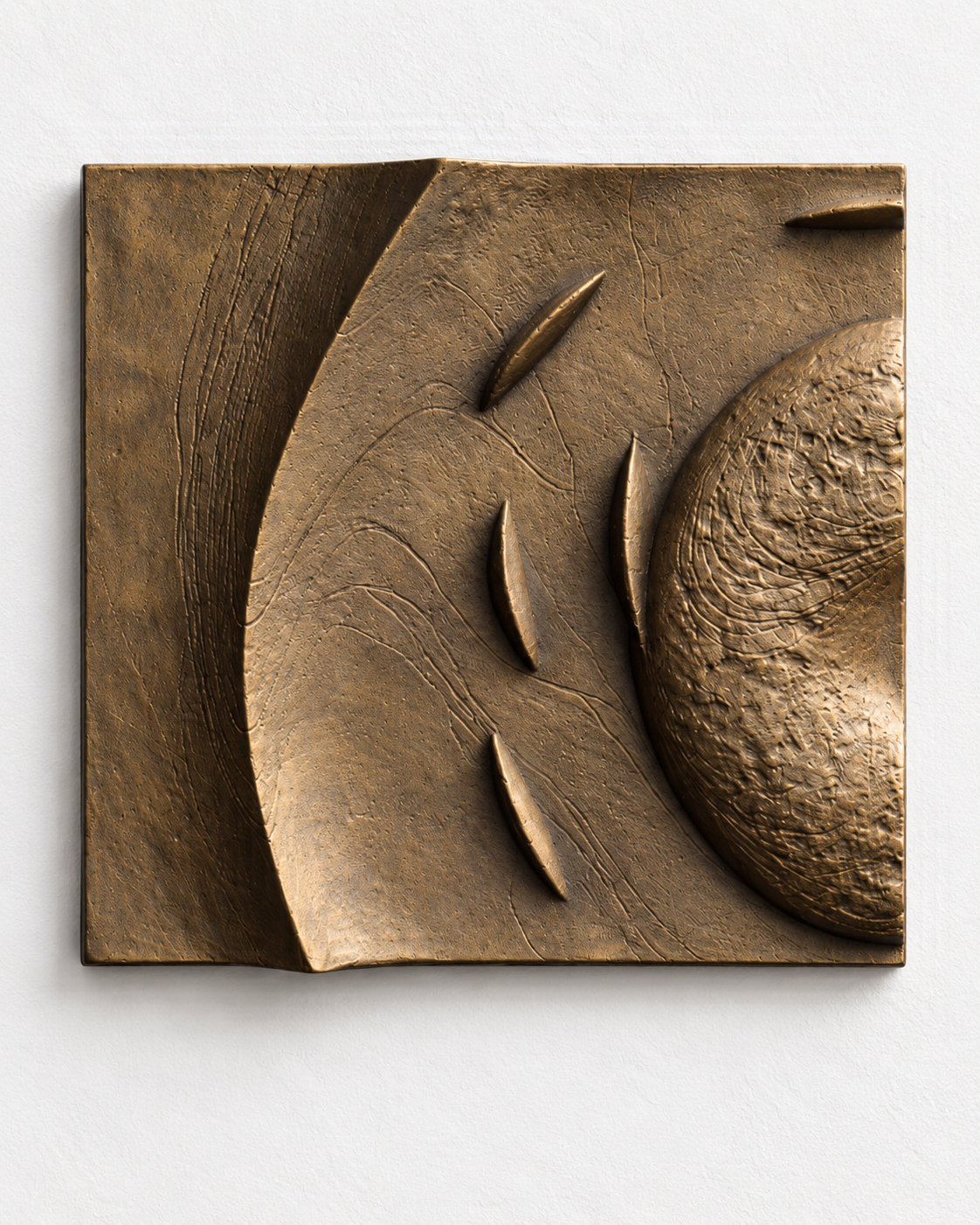 Bronze-coloured Spiralfish Wave and Tide 1 square relief with curved bands and small fish-like forms.