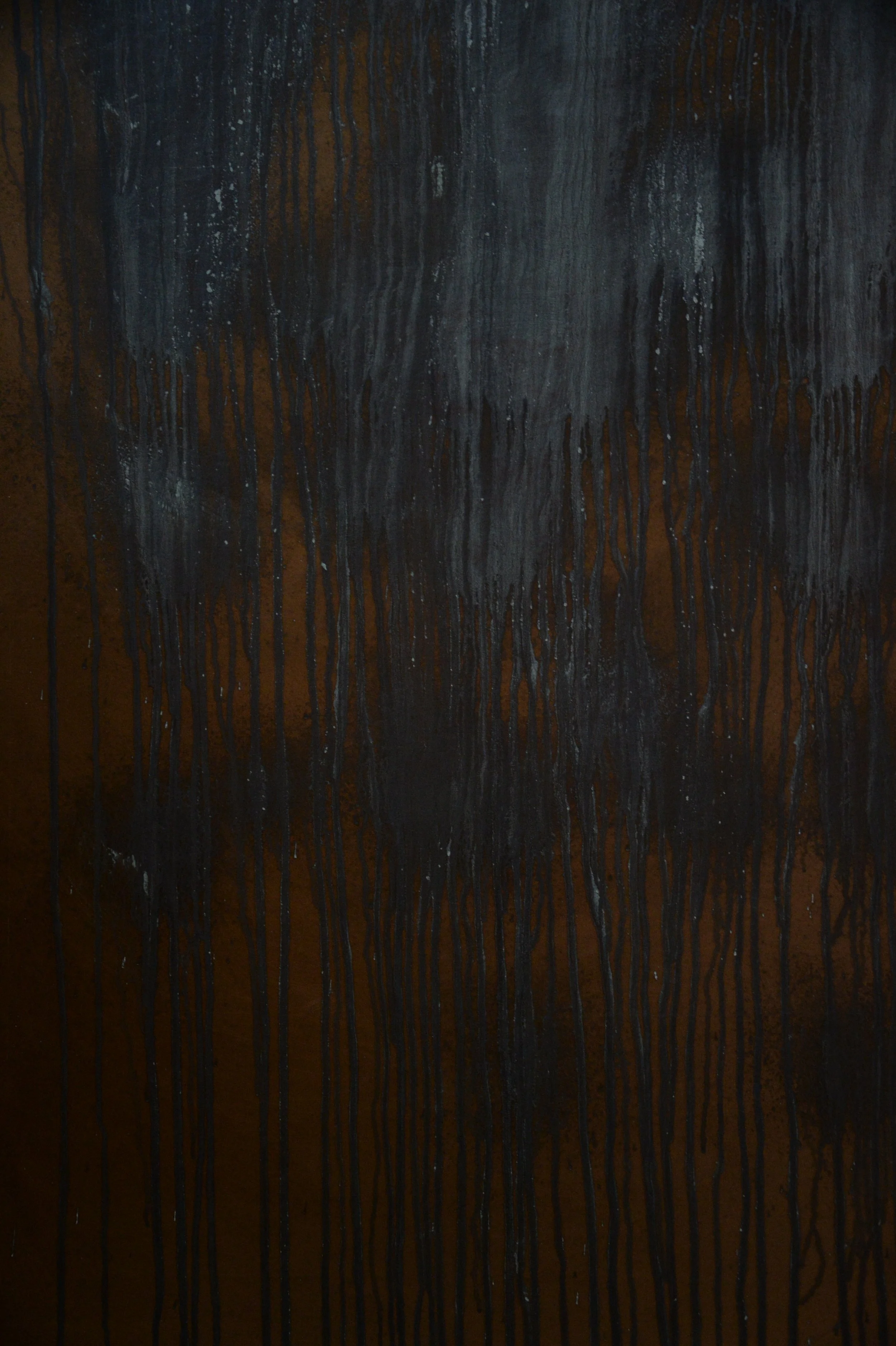 Tall textured panel with dark rust tones and blue patina streaks.