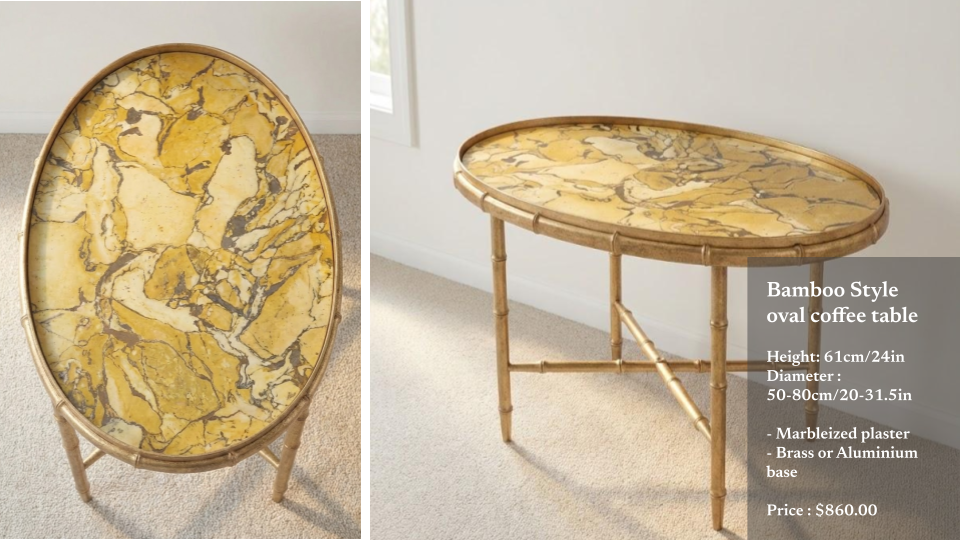 A bamboo-style oval coffee table with a yellow marbleized plaster top and bamboo legs, positioned on a beige carpet in a room with white walls.