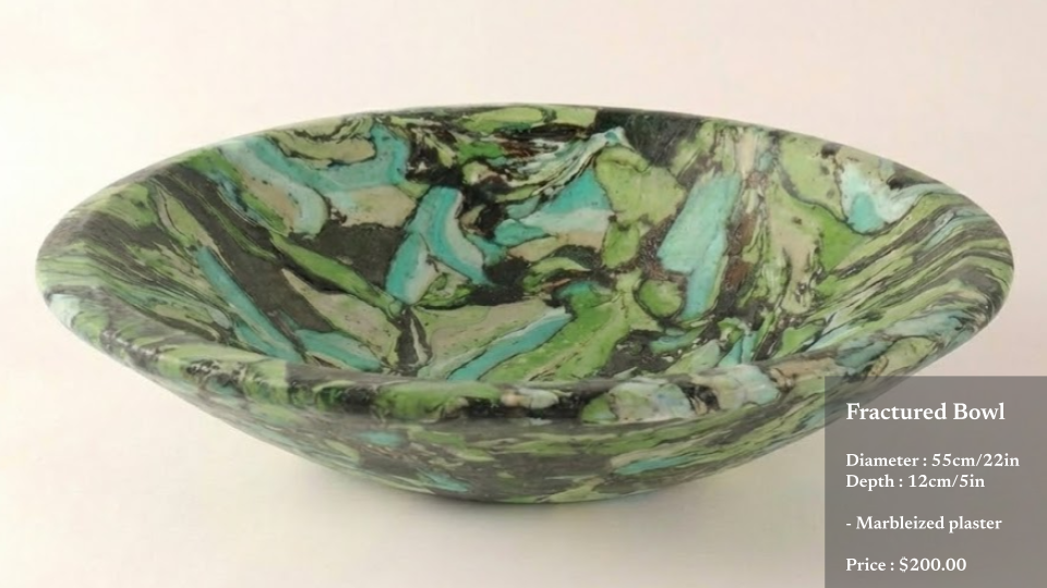 A marbled, fractured bowl with green, black, and blue colors, measuring 55cm in diameter and 12cm deep, made of marbleized plaster, priced at $200.
