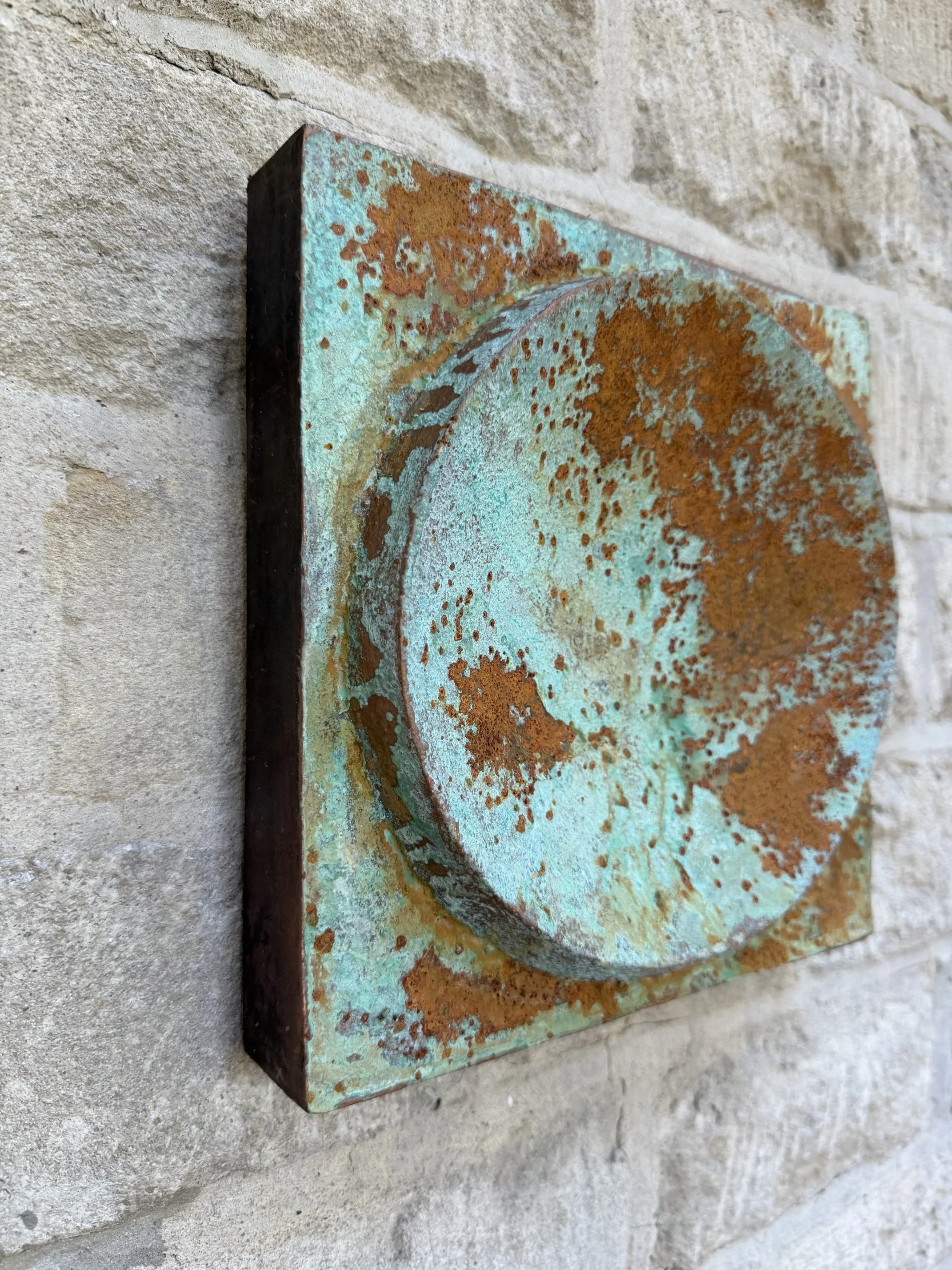 Moon Crater Phase Copper Verdigris Wall Sculpture seen from the side, showing the depth of the panel