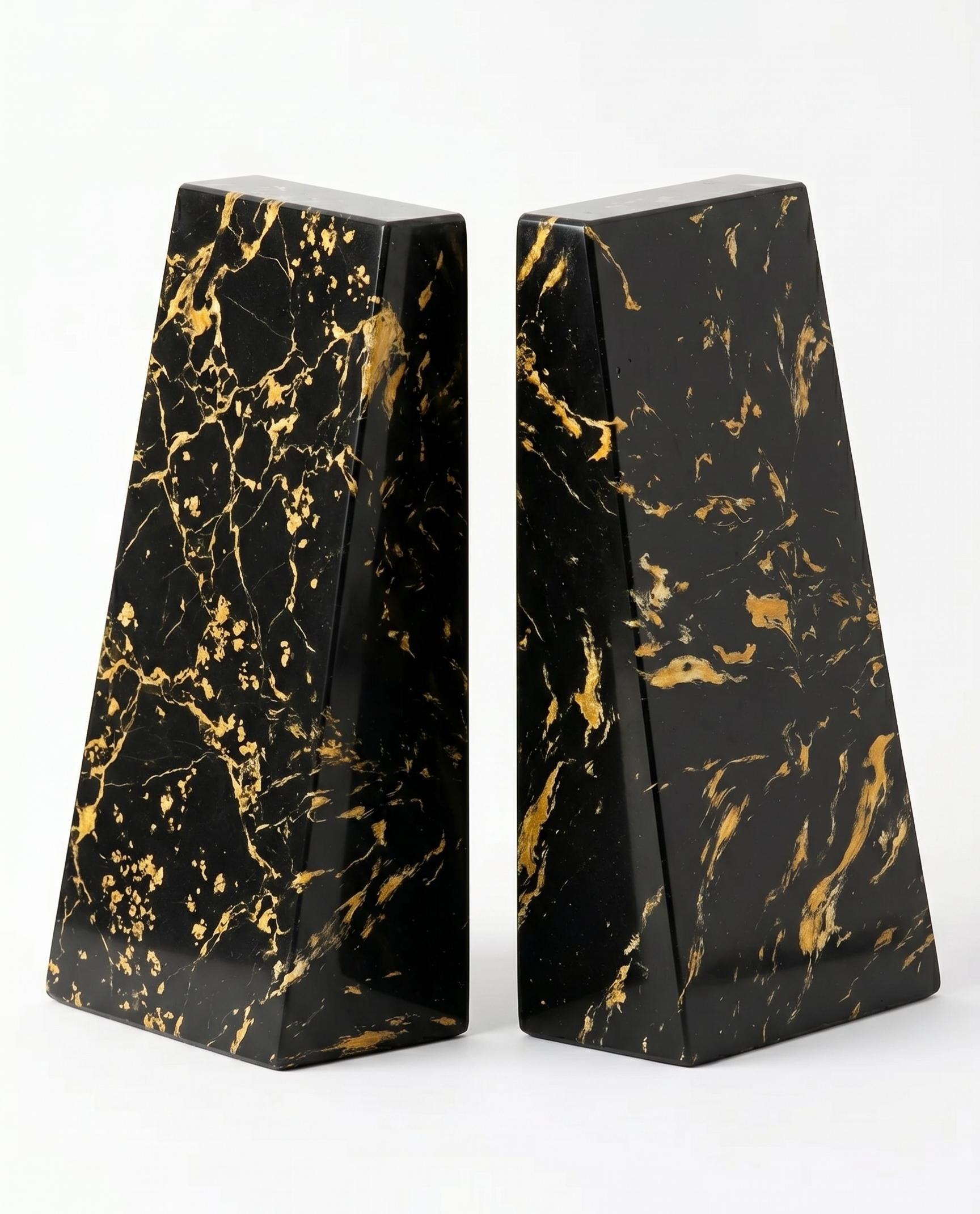 A pair of black and yellow marbled bookends standing back to back