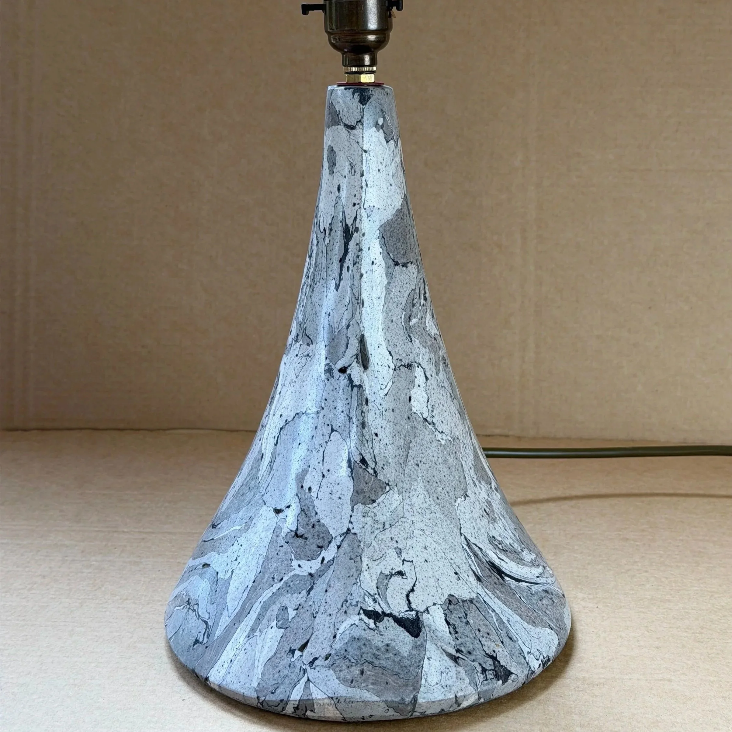 Gray Marble Table Lamp base seen from the front against a plain wall