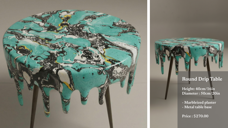 Round drip table with a turquoise, black, white, and yellow marbled plaster top and wooden legs displayed against a neutral background.