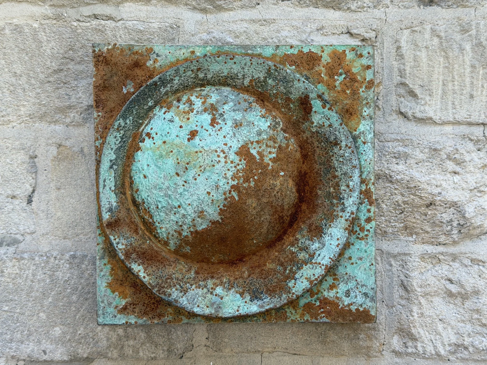 Close view of the Moon Crater Verdigris Rust Wall Sculpture showing the raised rim of the crater