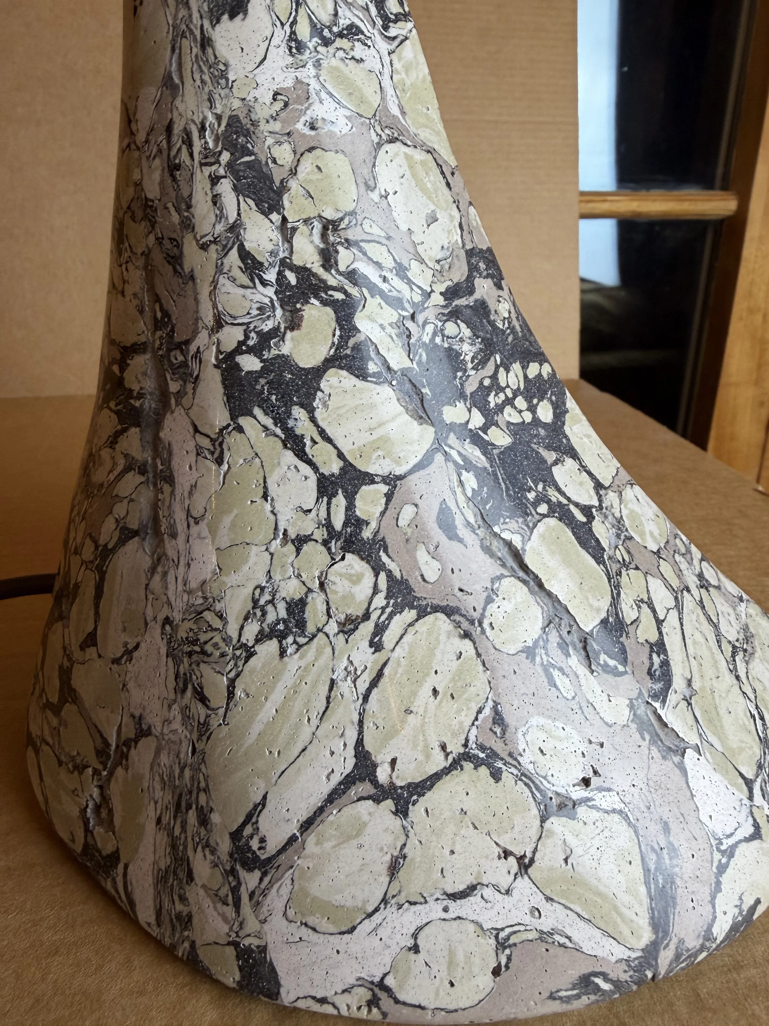 Close view of the Green and Cream Lamp base showing the varied scale of the marbled pebbles