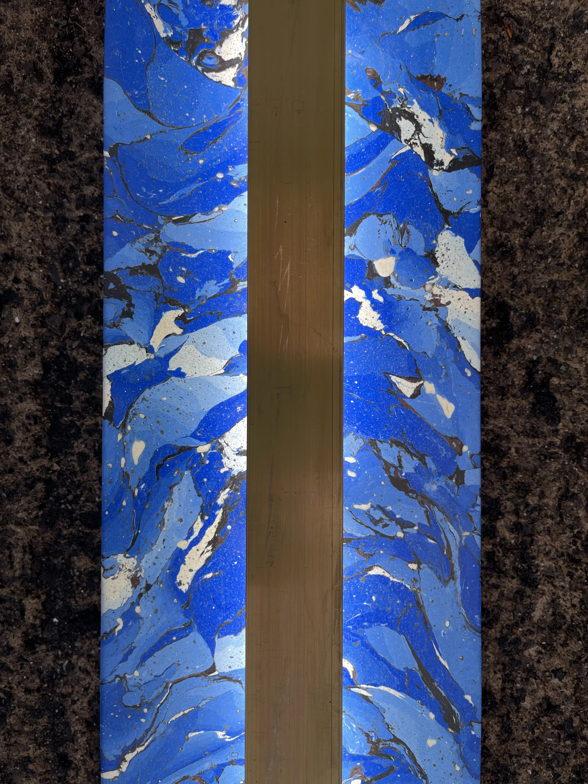 Shattered Blue Sconce with Brass Accent, the brass strip running the length of the blue marbled panel