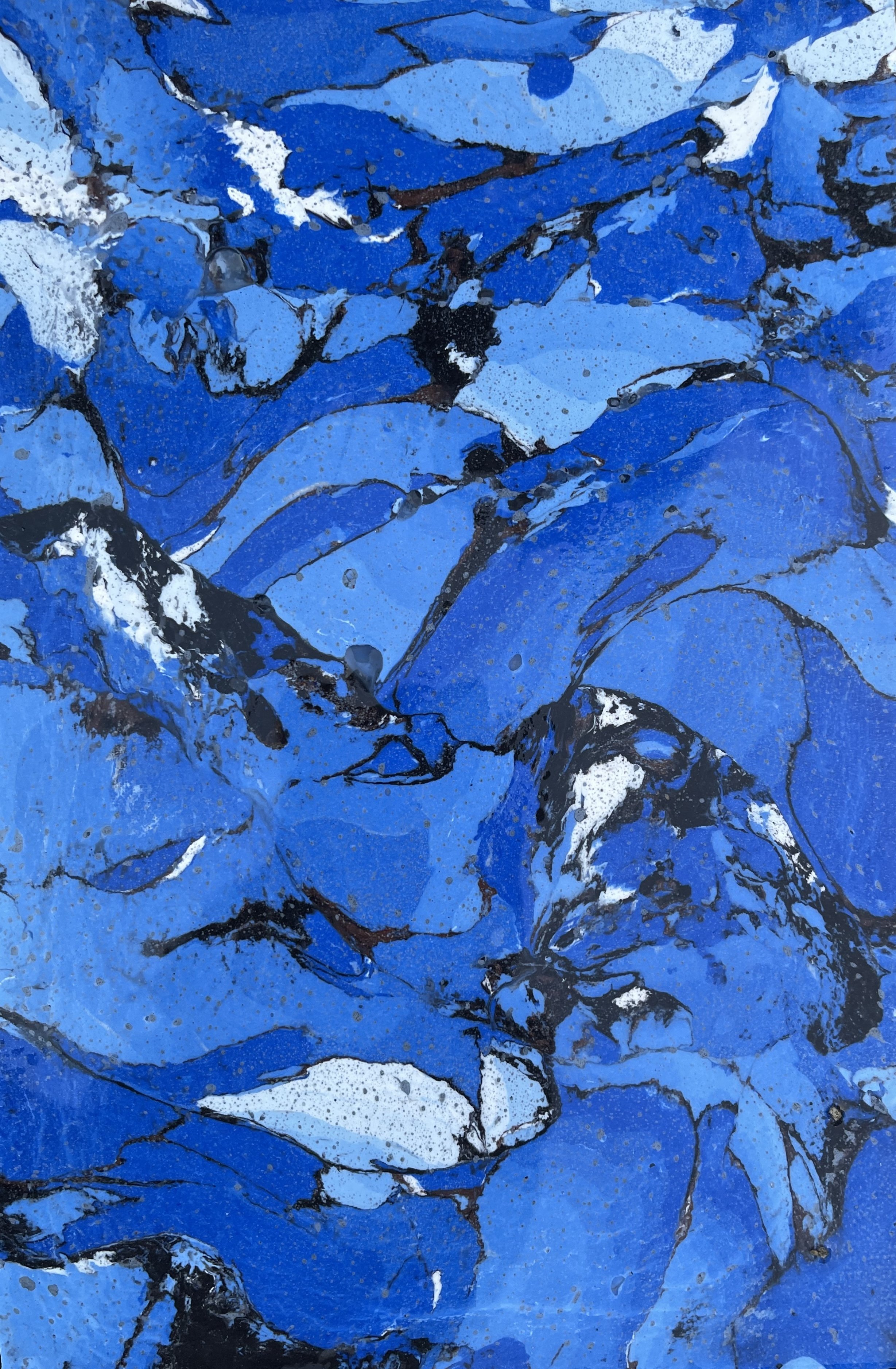 Abstract painting with blue, black, and white swirling patterns.