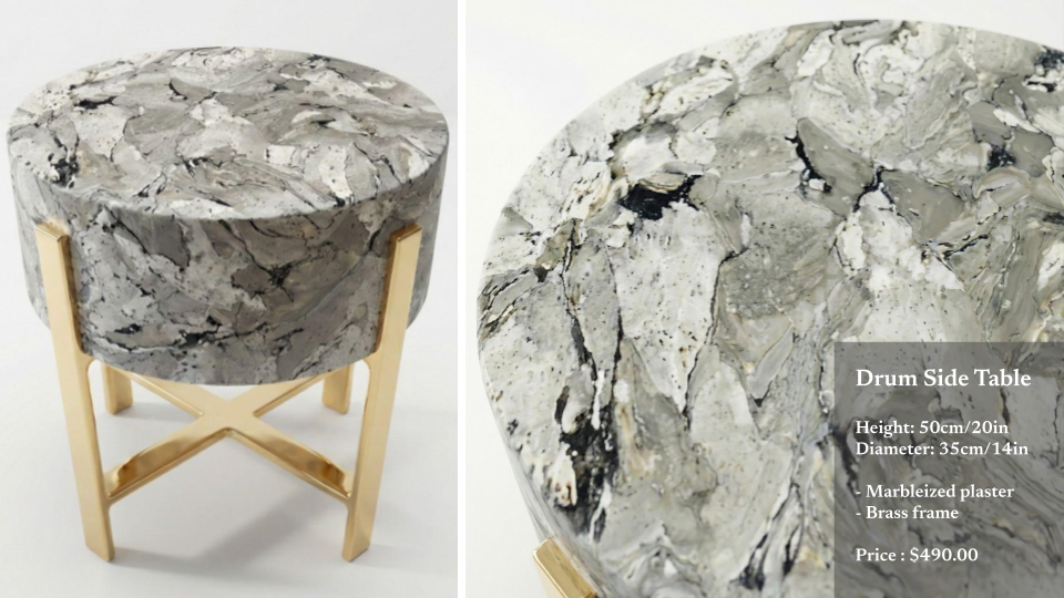 A marbleized plaster drum side table with a gold-colored brass frame, measuring 50 cm in height and 35 cm in diameter, priced at $490.