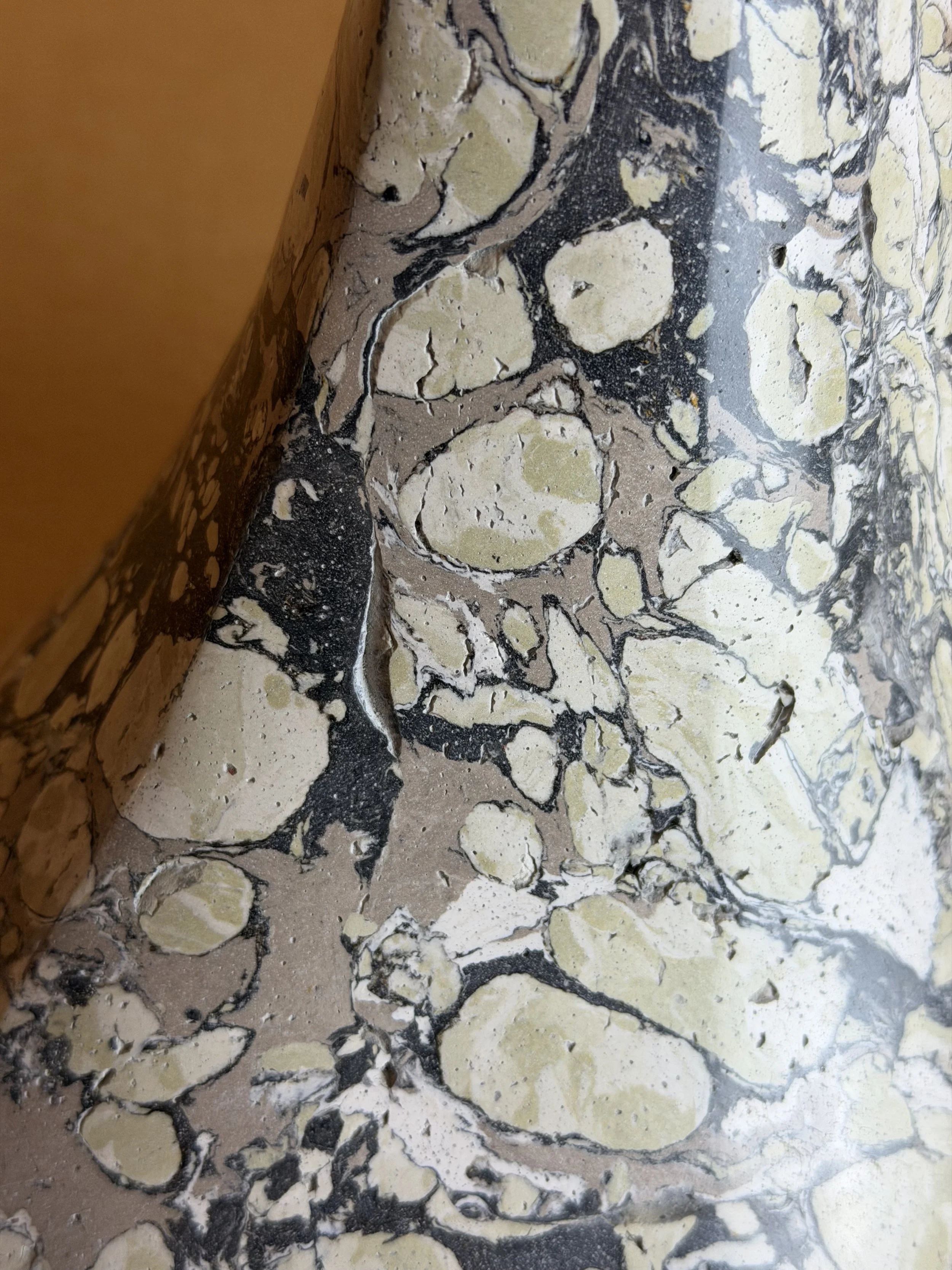 Close view of the Green and Cream Lamp base showing the pebbled cream and charcoal marbling