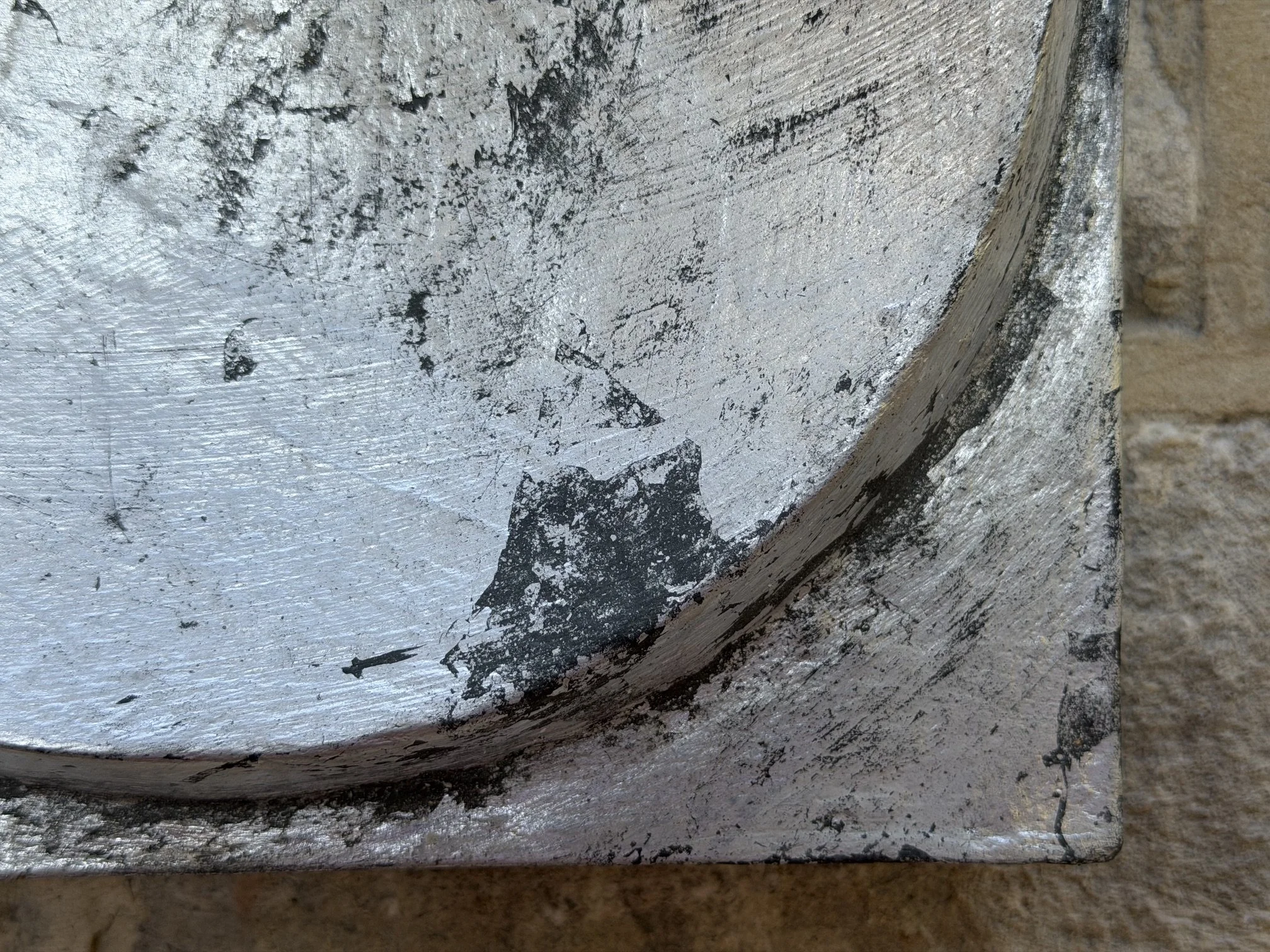 Close detail of the Silver and Bronze on Concave Moon showing the curve of the hollow and its silvered surface