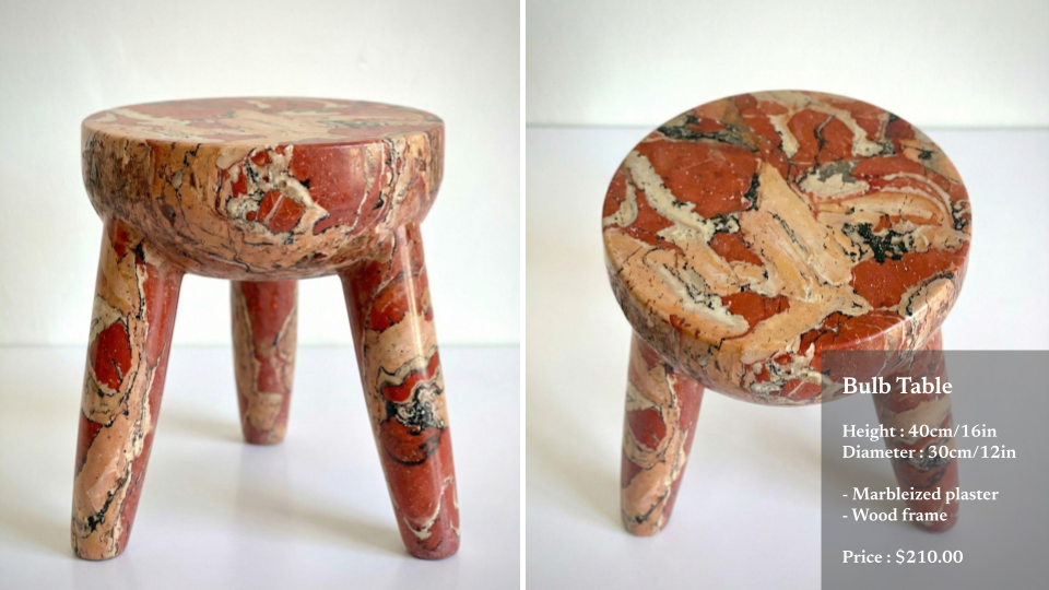 A small bulb-shaped table with a marbleized plaster top and three curved wood legs, priced at $210, shown from front and top angles.