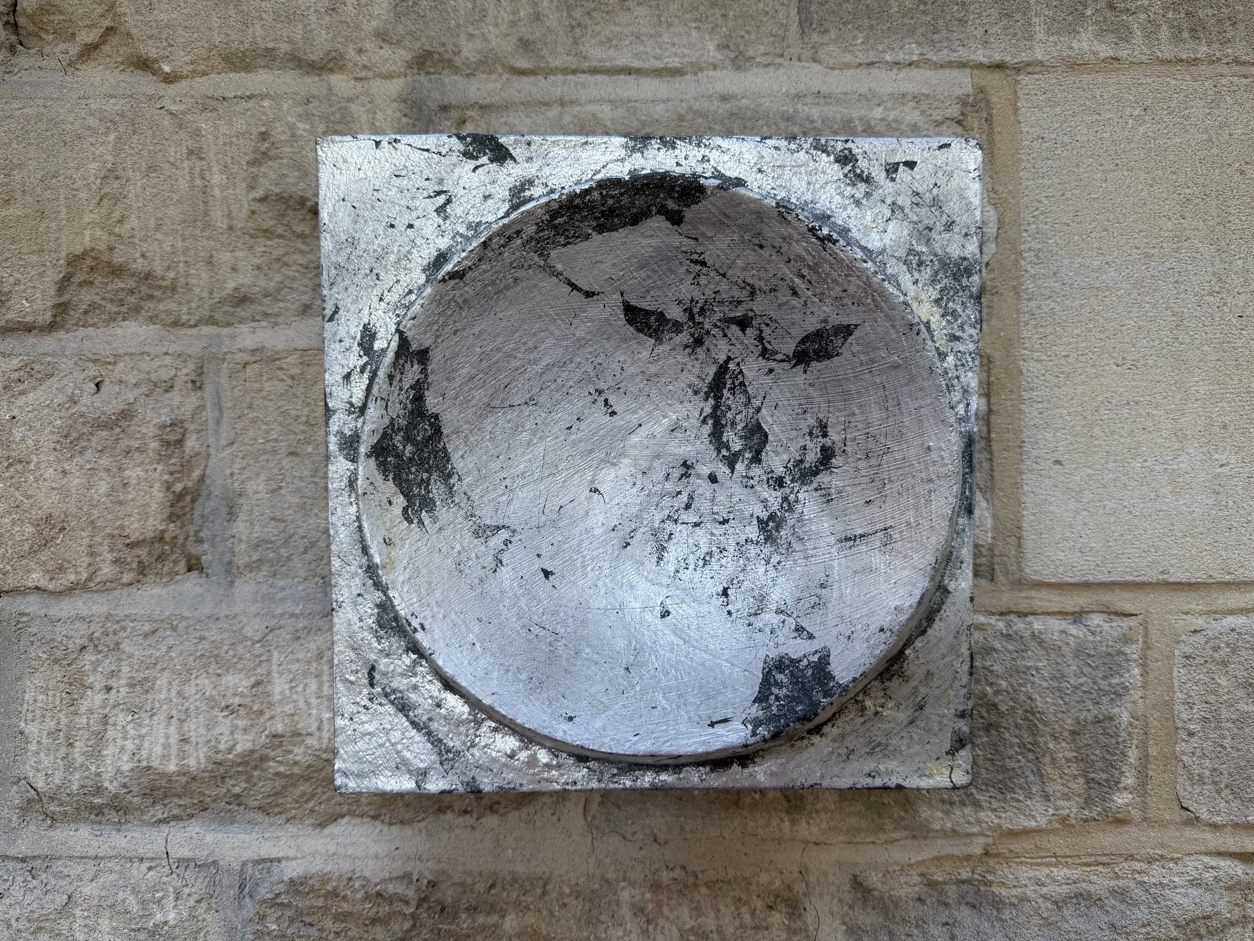 Silver and Bronze on Concave Moon seen closer, the silvered hollow marked with dark bronze patches
