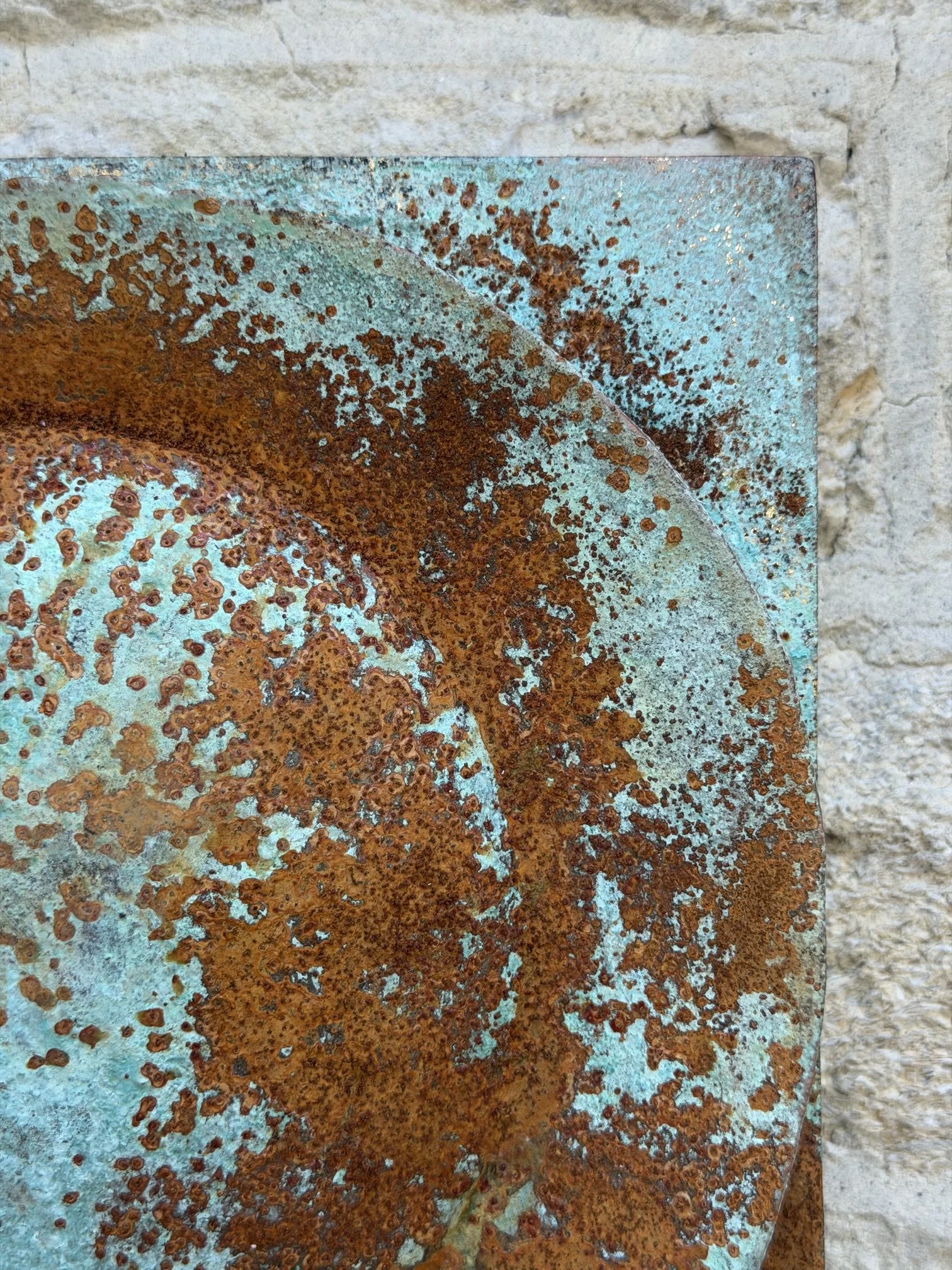 Detail of the Moon Crater Phase Blue Wall Sculpture showing the concentric rings of the crater