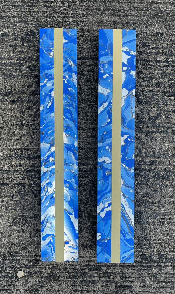 A pair of Shattered Blue Sconces with brass accents shown side by side