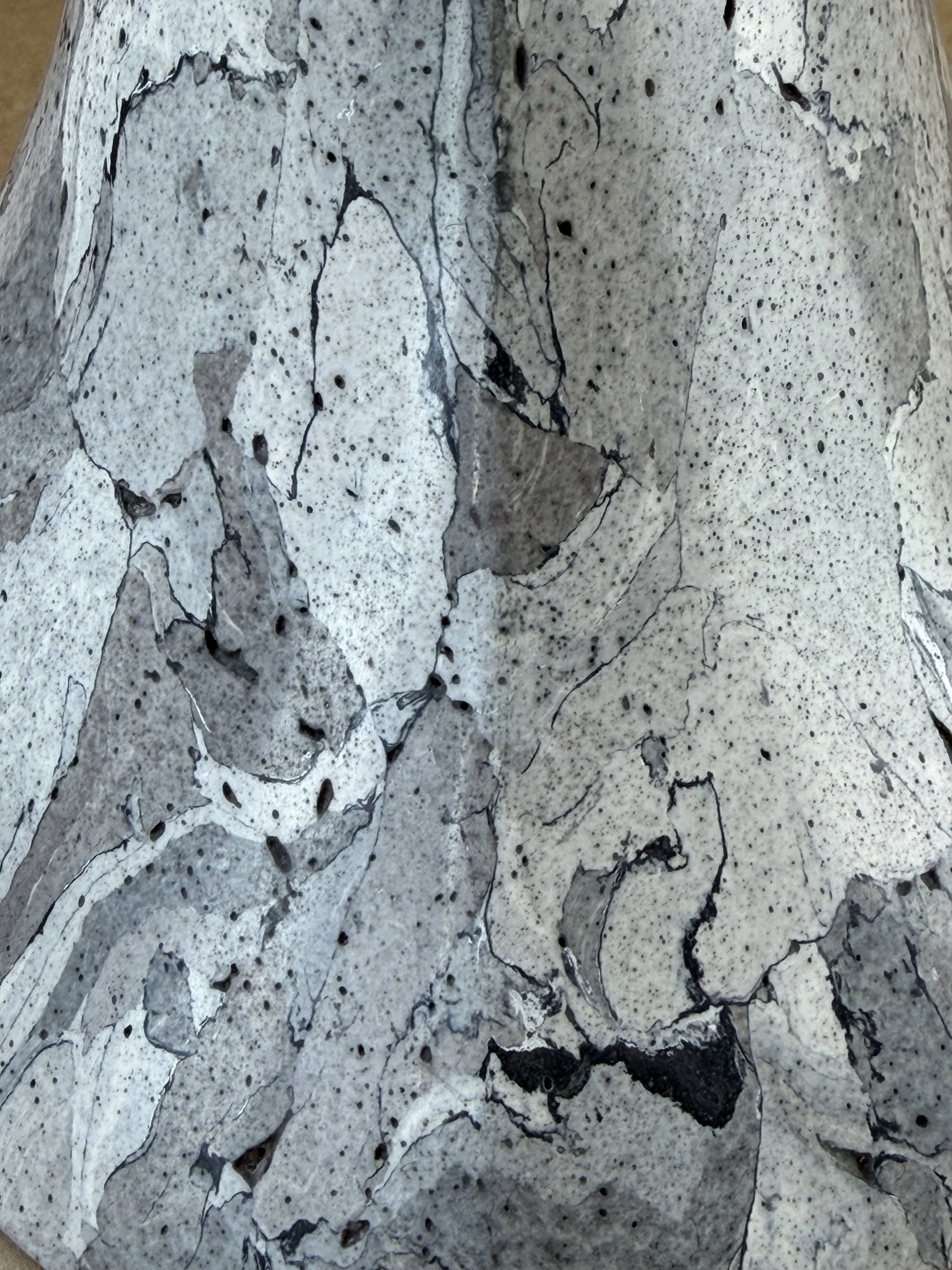 Close view of the Gray Marble Table Lamp base marbling, pale plates over a speckled grey ground