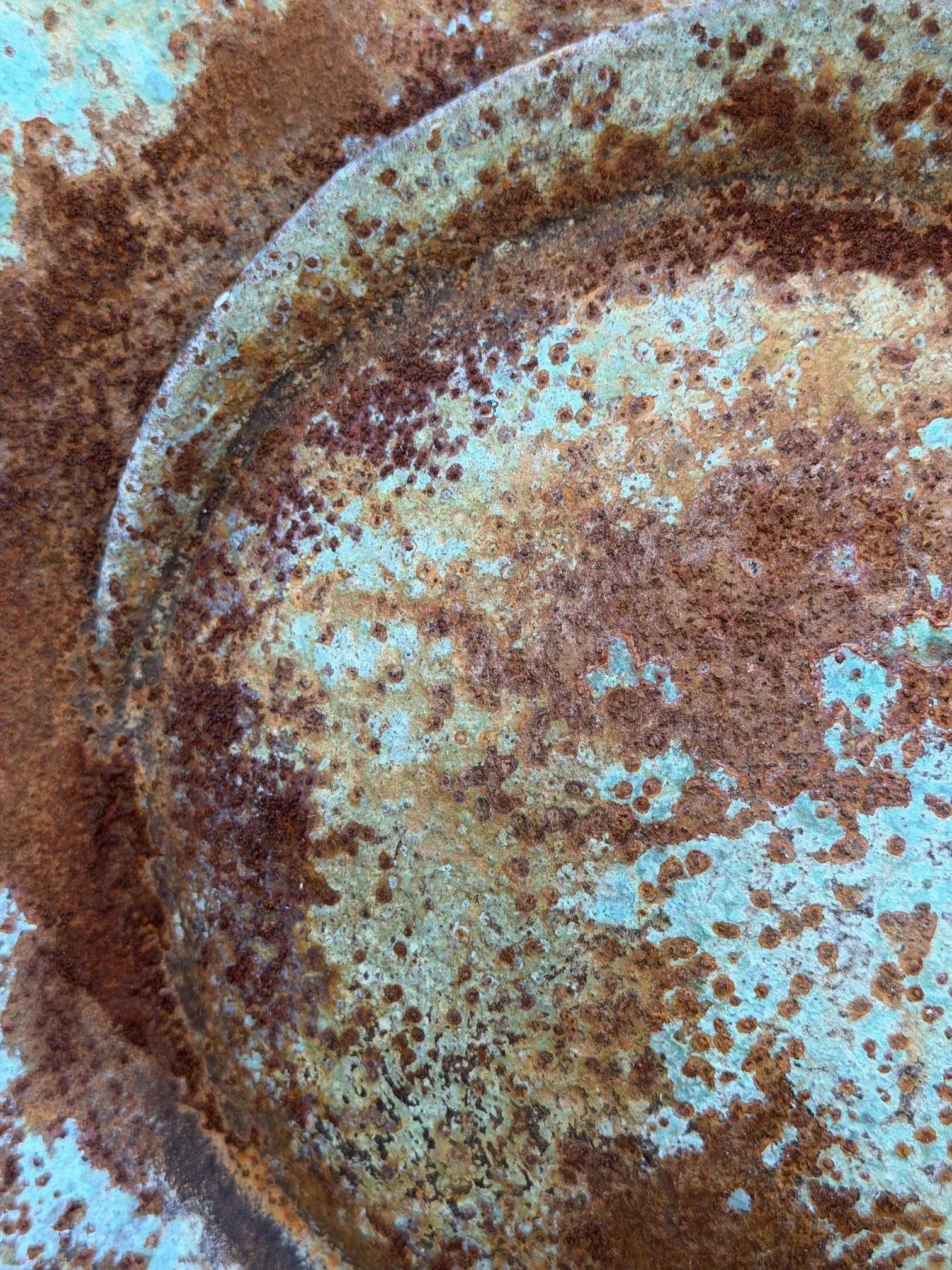 Close detail of the Moon Crater Phase Verdigris Spherical Wall Sculpture showing the mottled crater surface