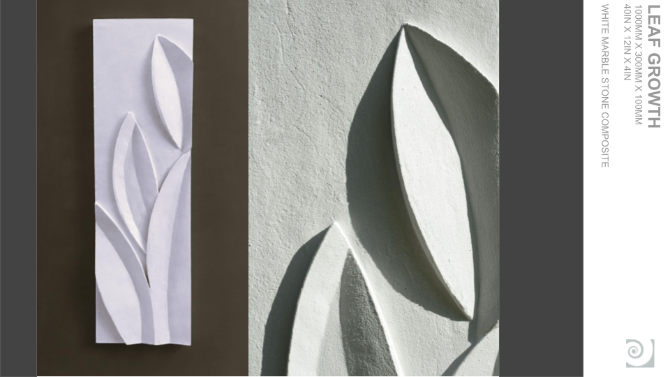 White marble sculpture of elongated leaf shapes mounted on a wall, casting shadows.
