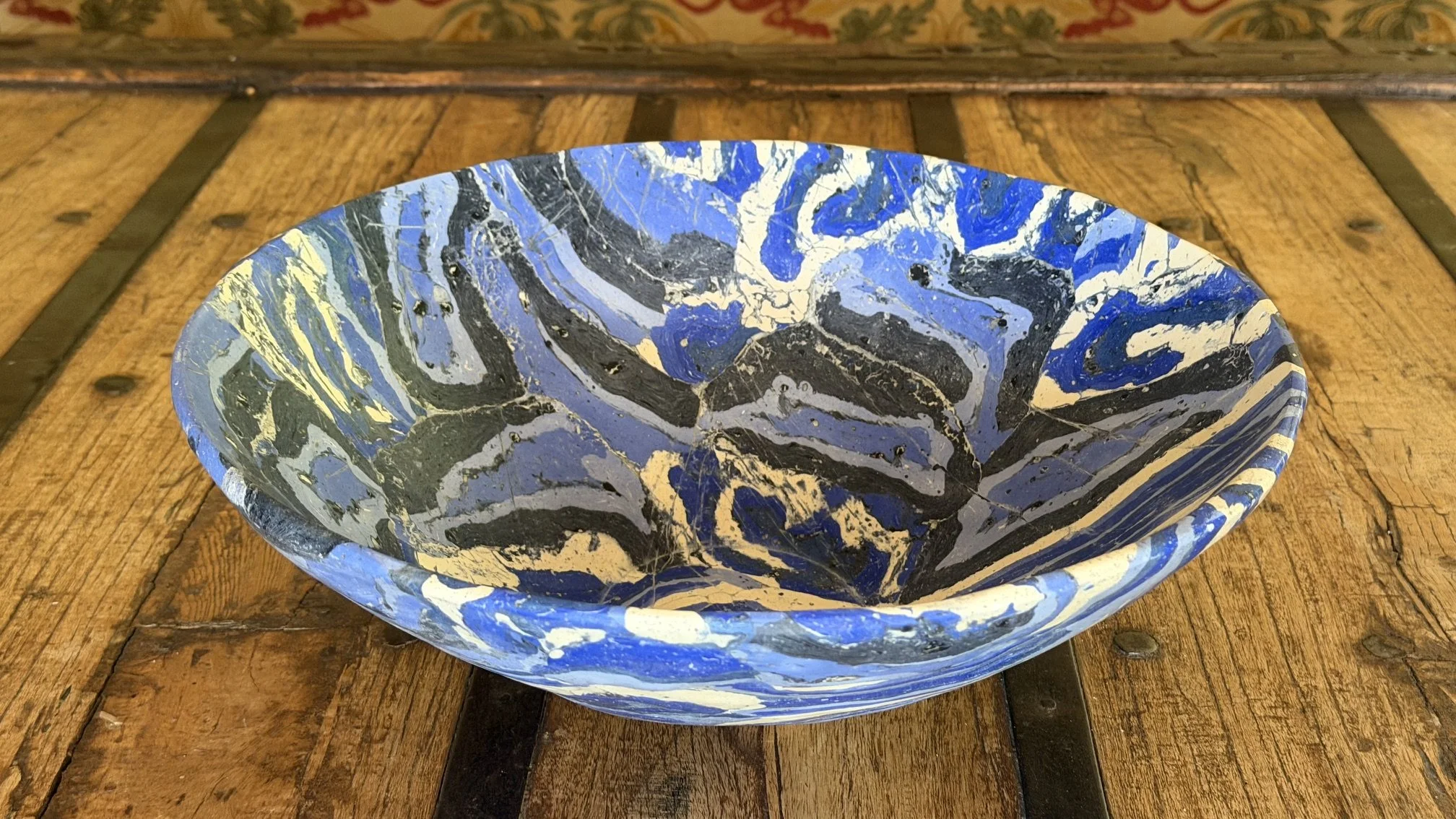 Blue Rustic Gypsum Bowl photographed from above at an angle, showing the marbled interior