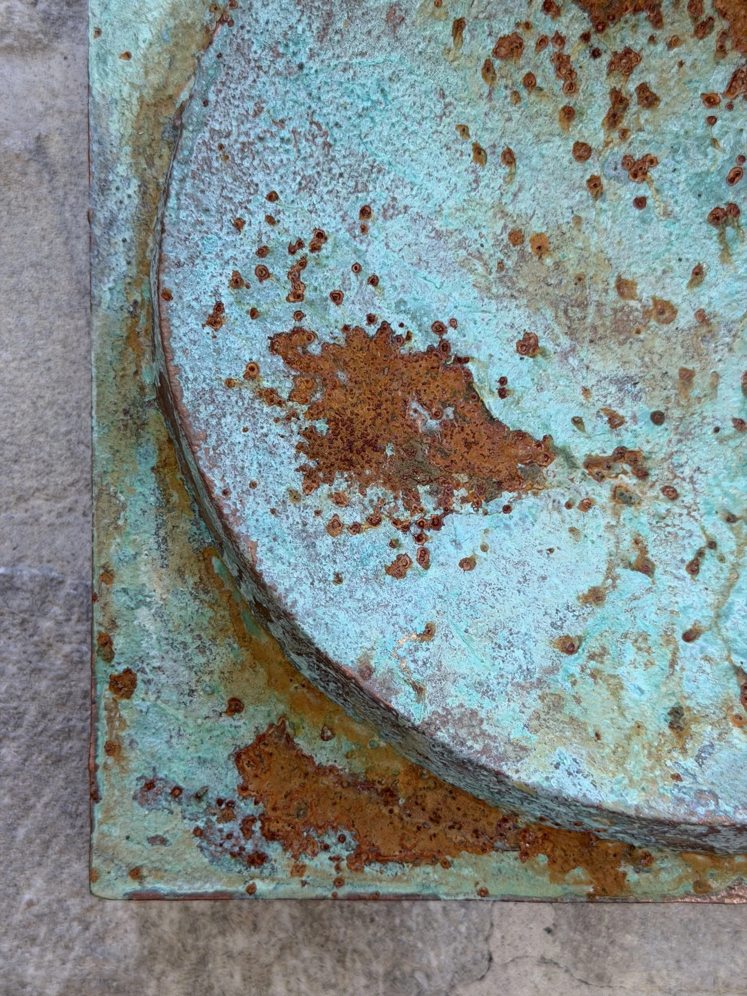 Moon Crater Phase Copper Verdigris Wall Sculpture seen from below, the crater disc rimmed in copper