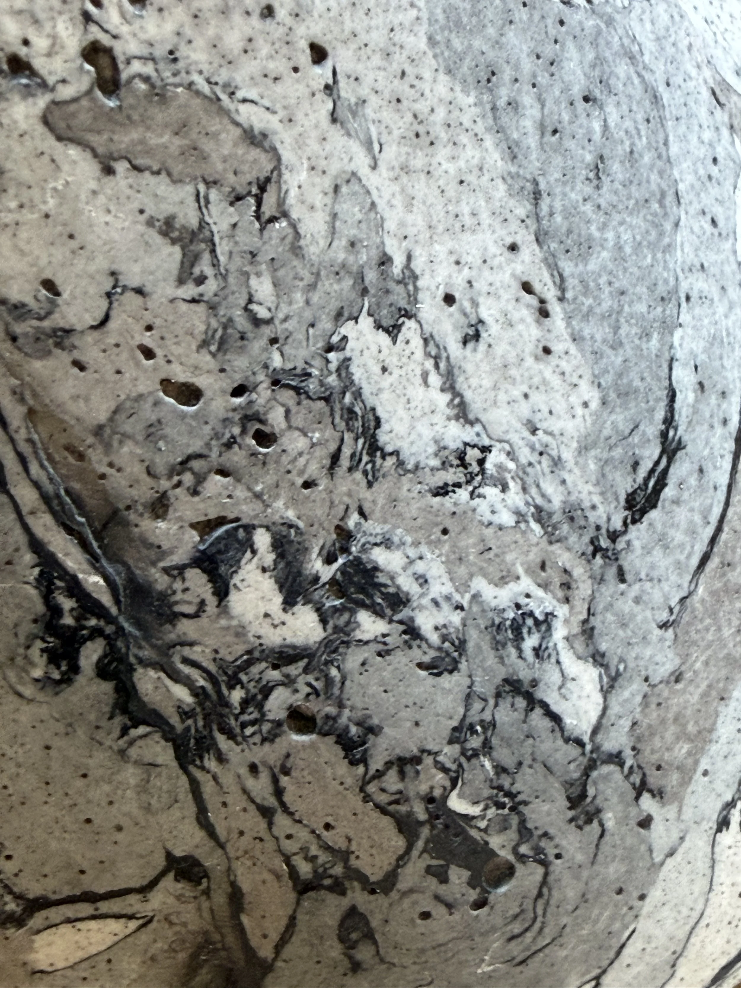 Close detail of the Gray Marble Table Lamp base surface, its marbled plates and speckled ground