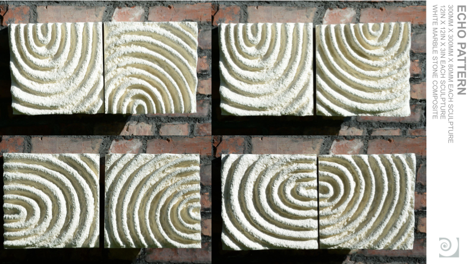 Four ceramic tiles with carved spiral patterns, arranged on a brick wall.